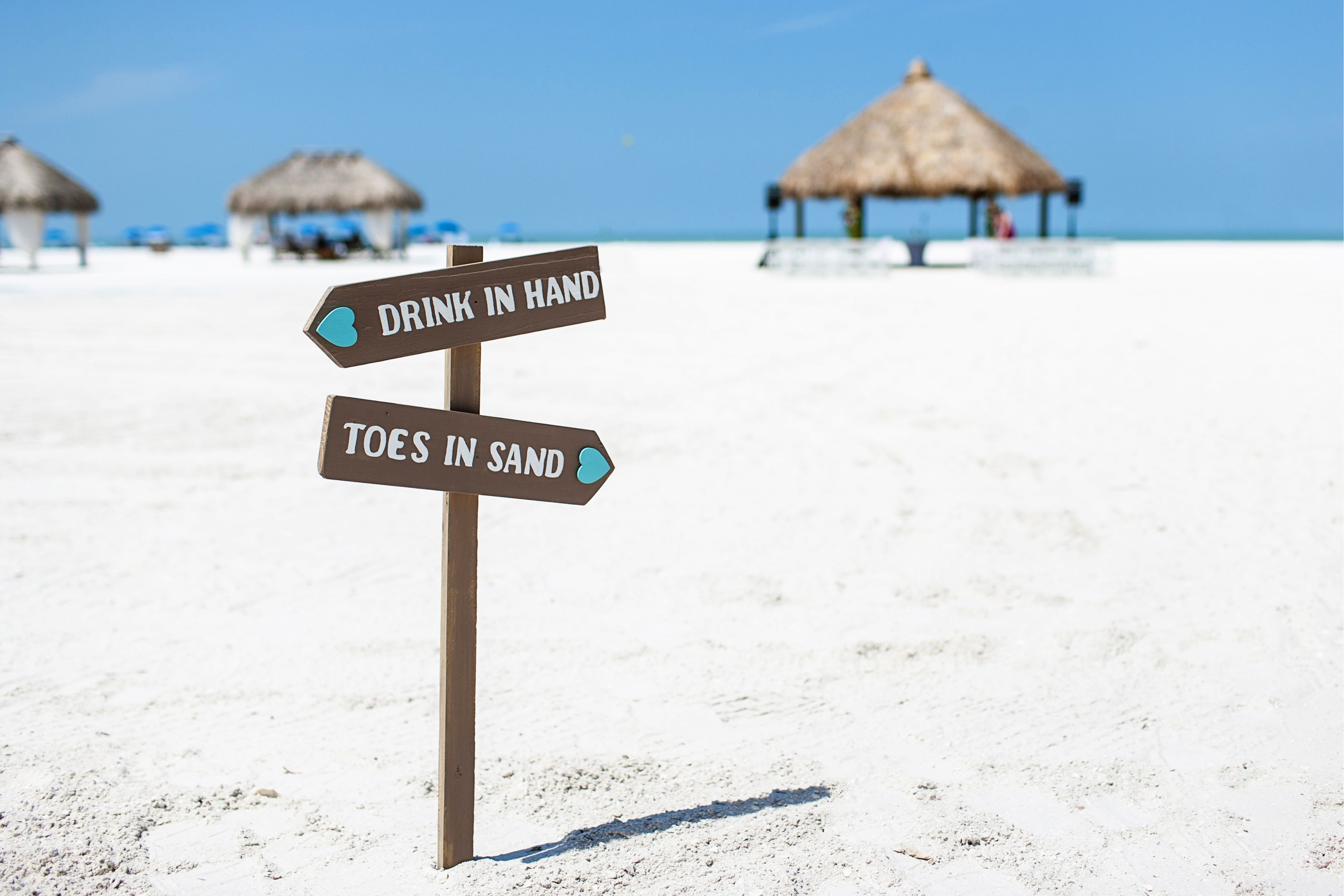Drink in Hand toes in sand beach sign