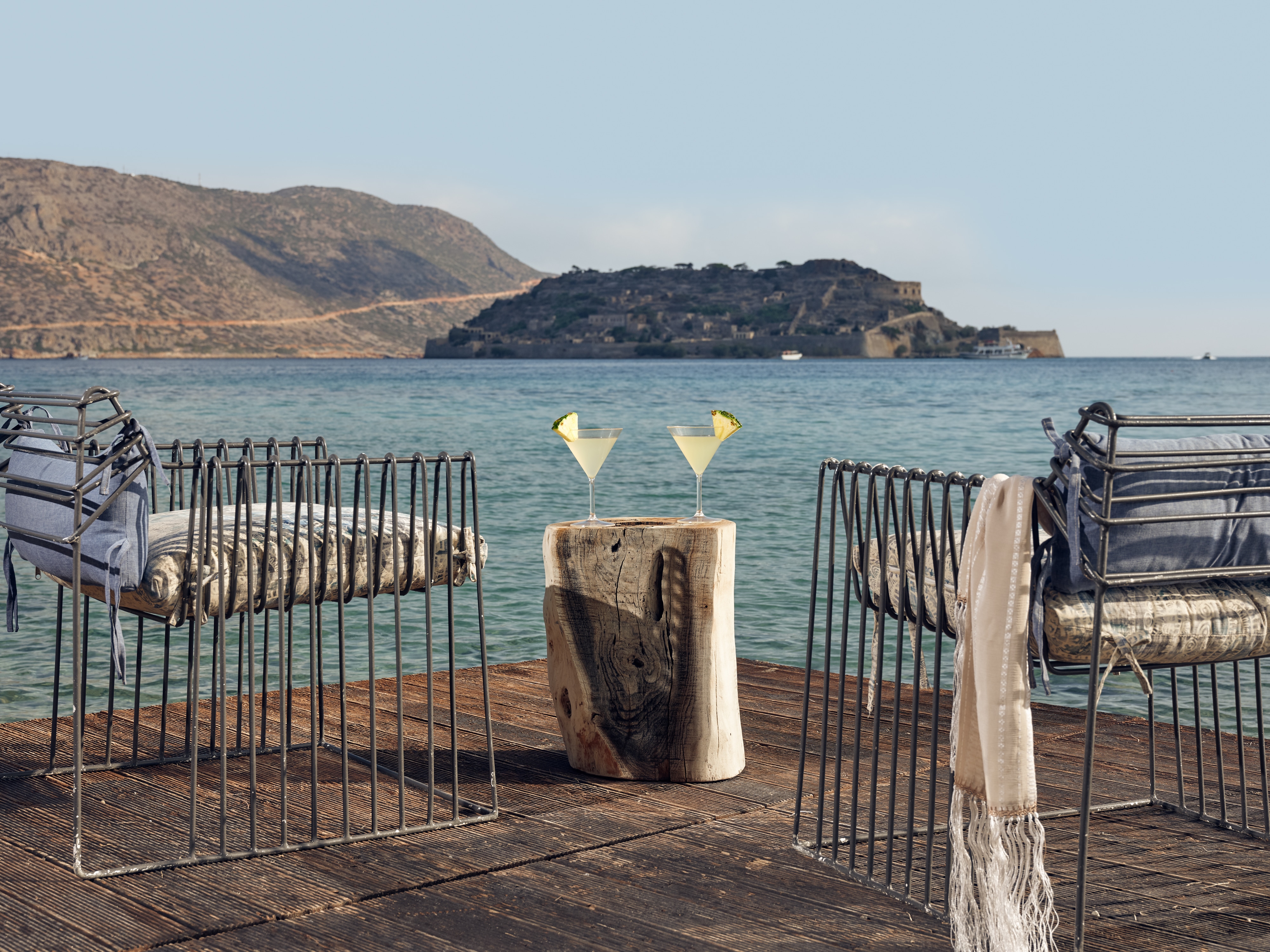 Beachside bliss: armchairs, cocktails at Domes of Elounda, Greece