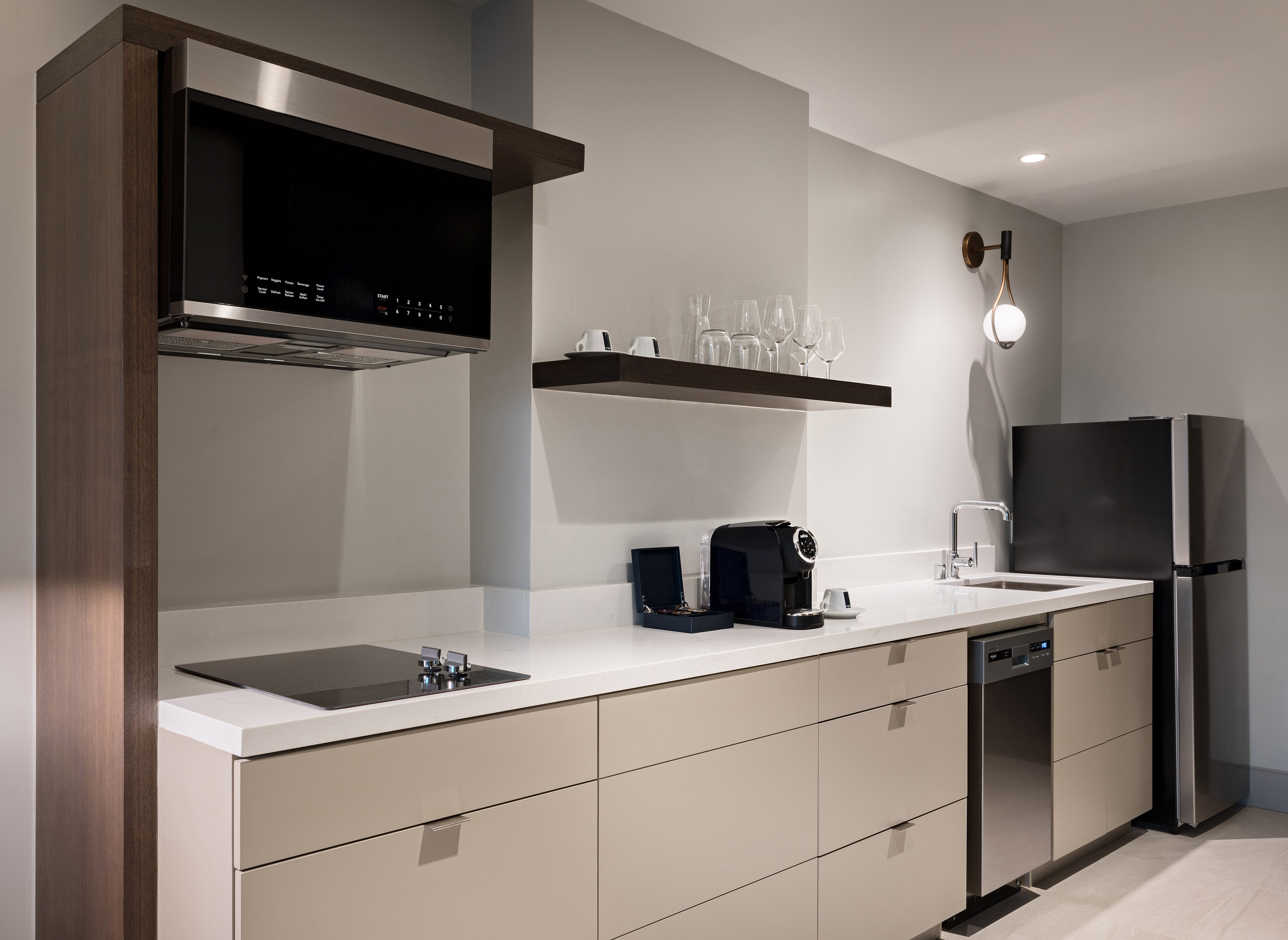 Kitchenette with stove, microwave, fridge, sink