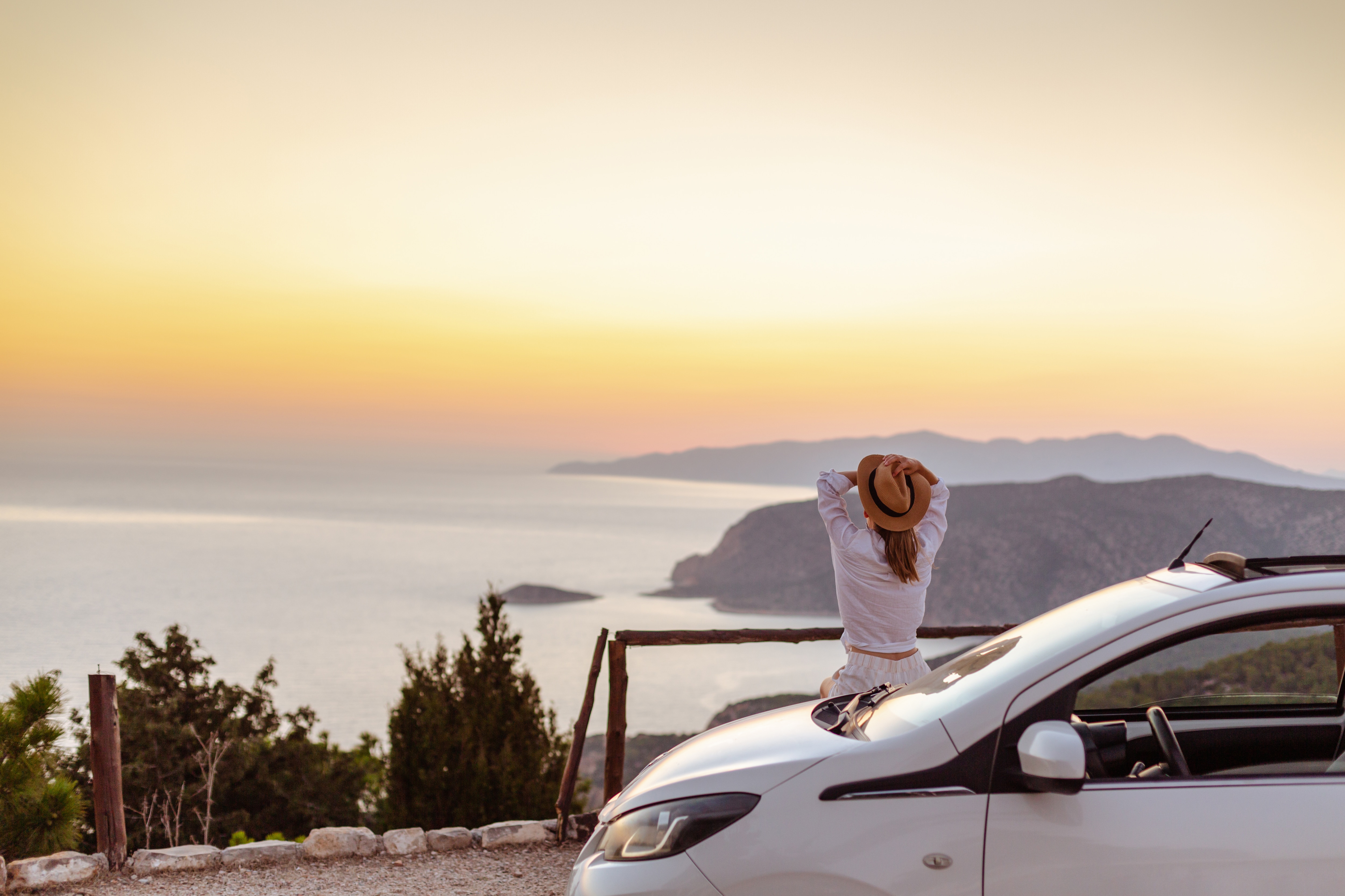 Woman on a roadtrip looking at scenic overpass