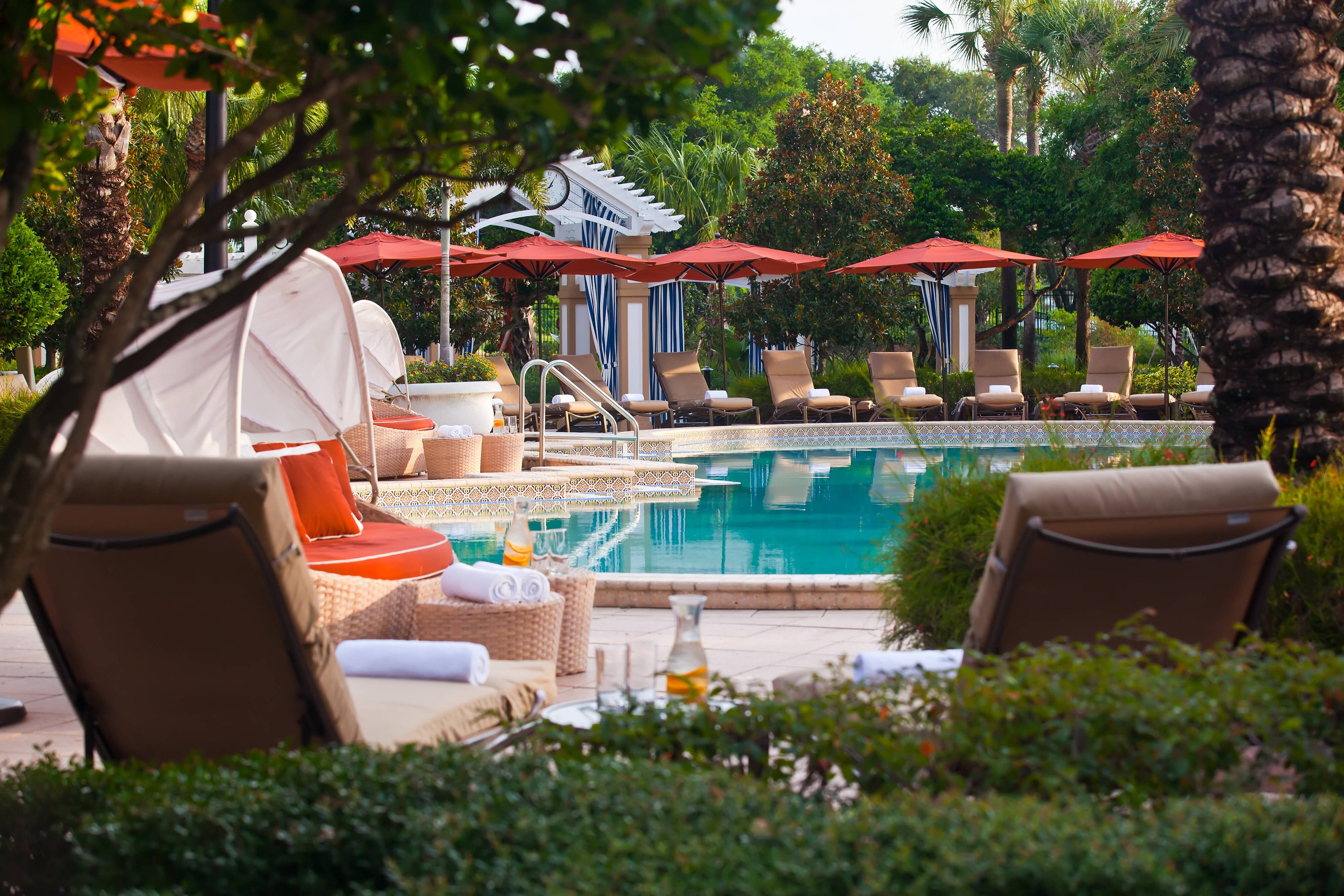 pool, lounge chairs, umbrella