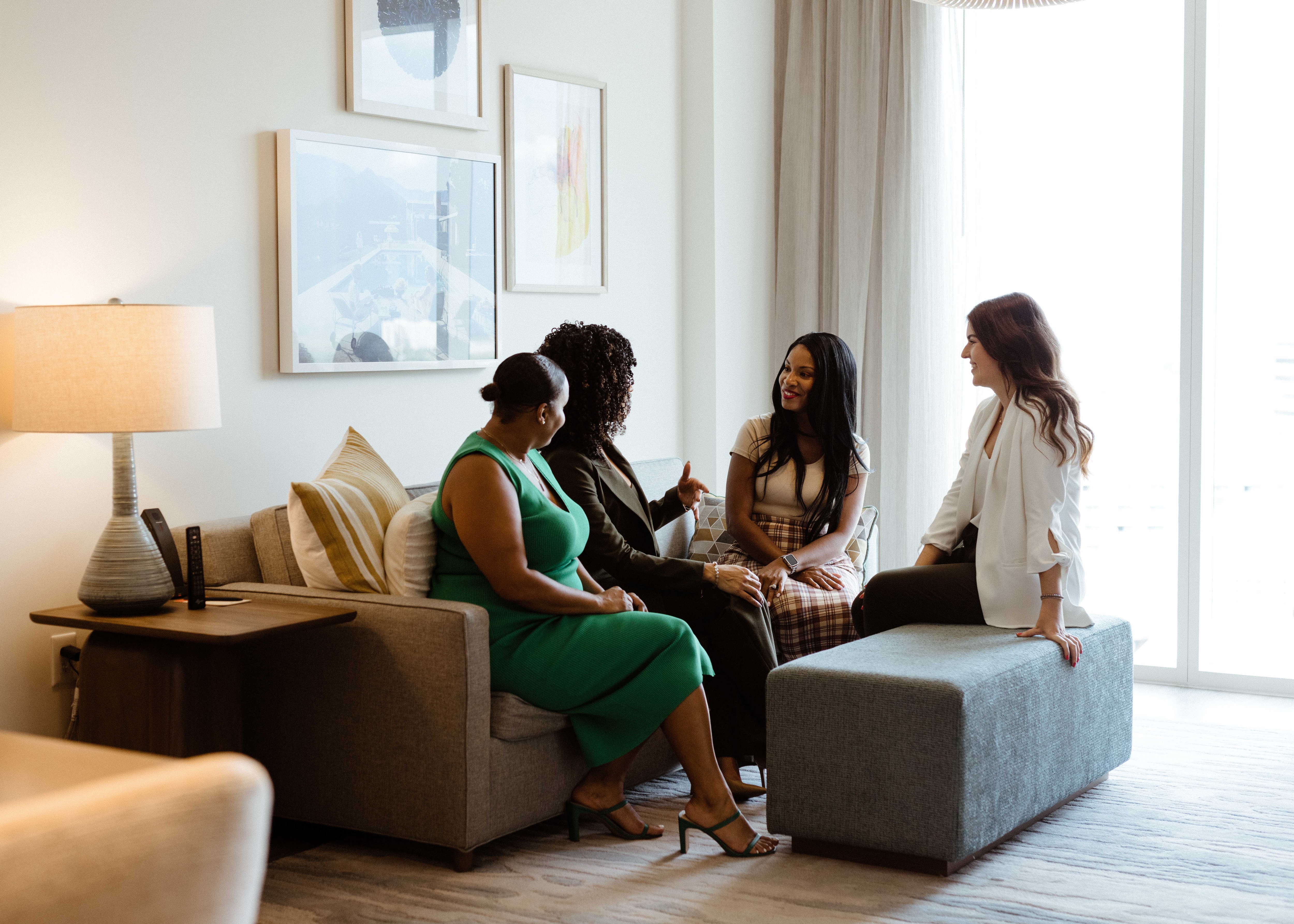 Colleagues networking in a conference suite 