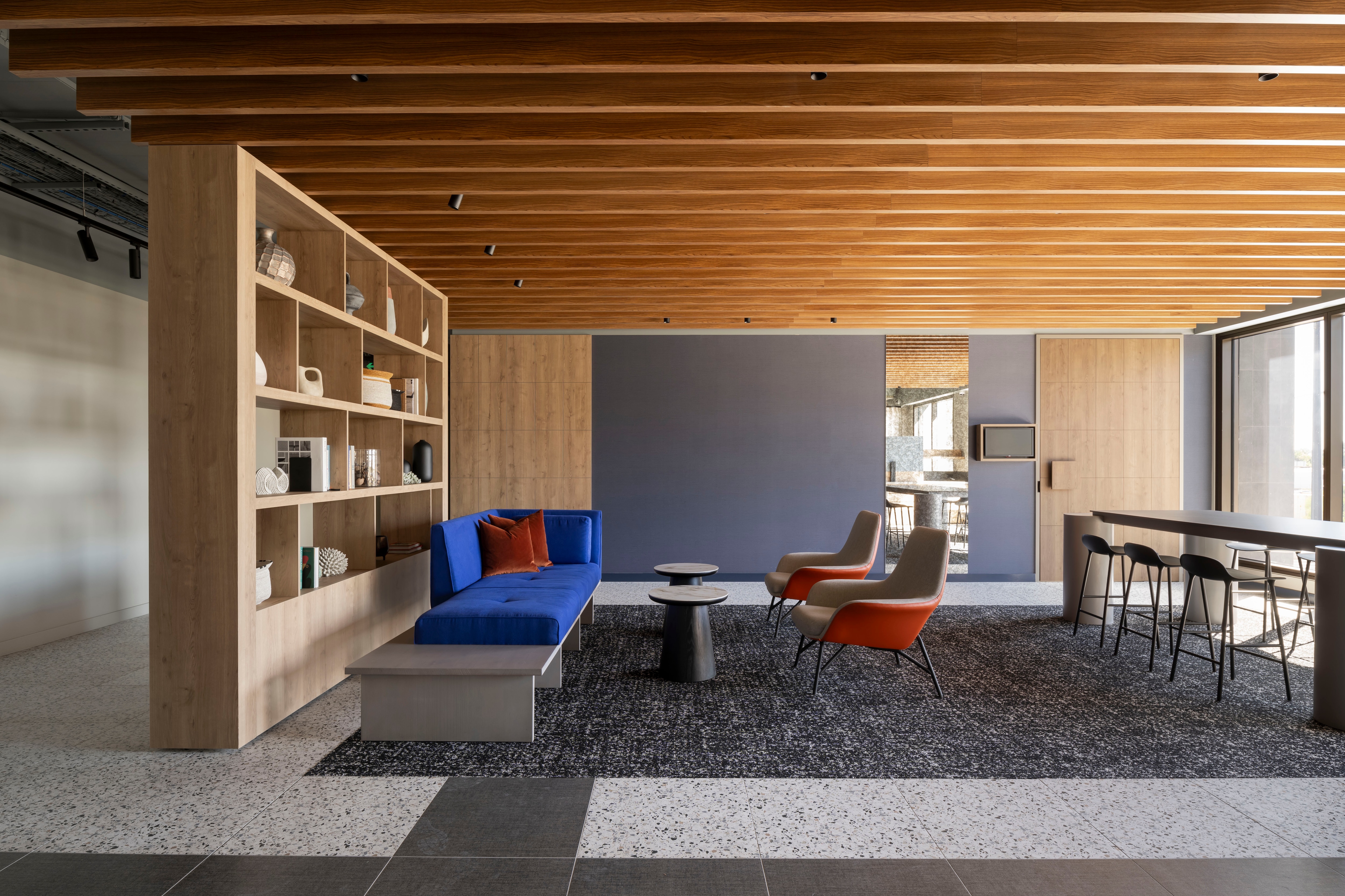 Pre-function space with bookshelf and seating