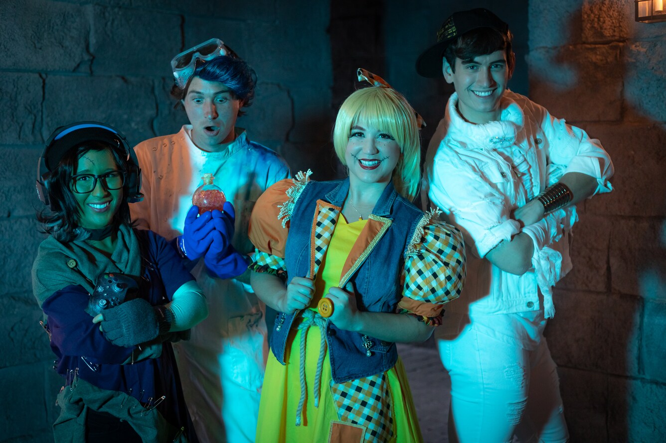 Actors posing in Halloween costumes.