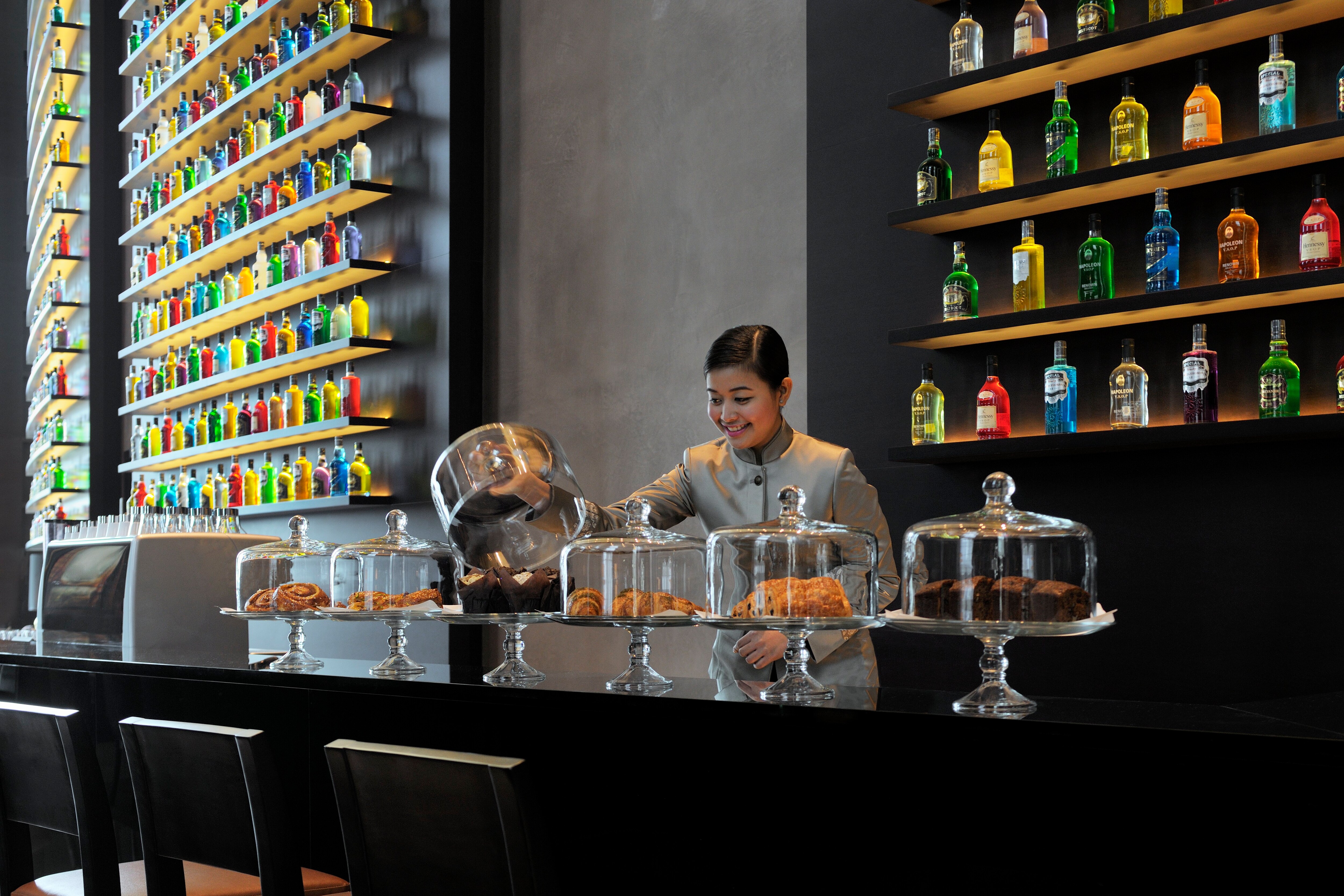 Lounge staff displaying baked goods