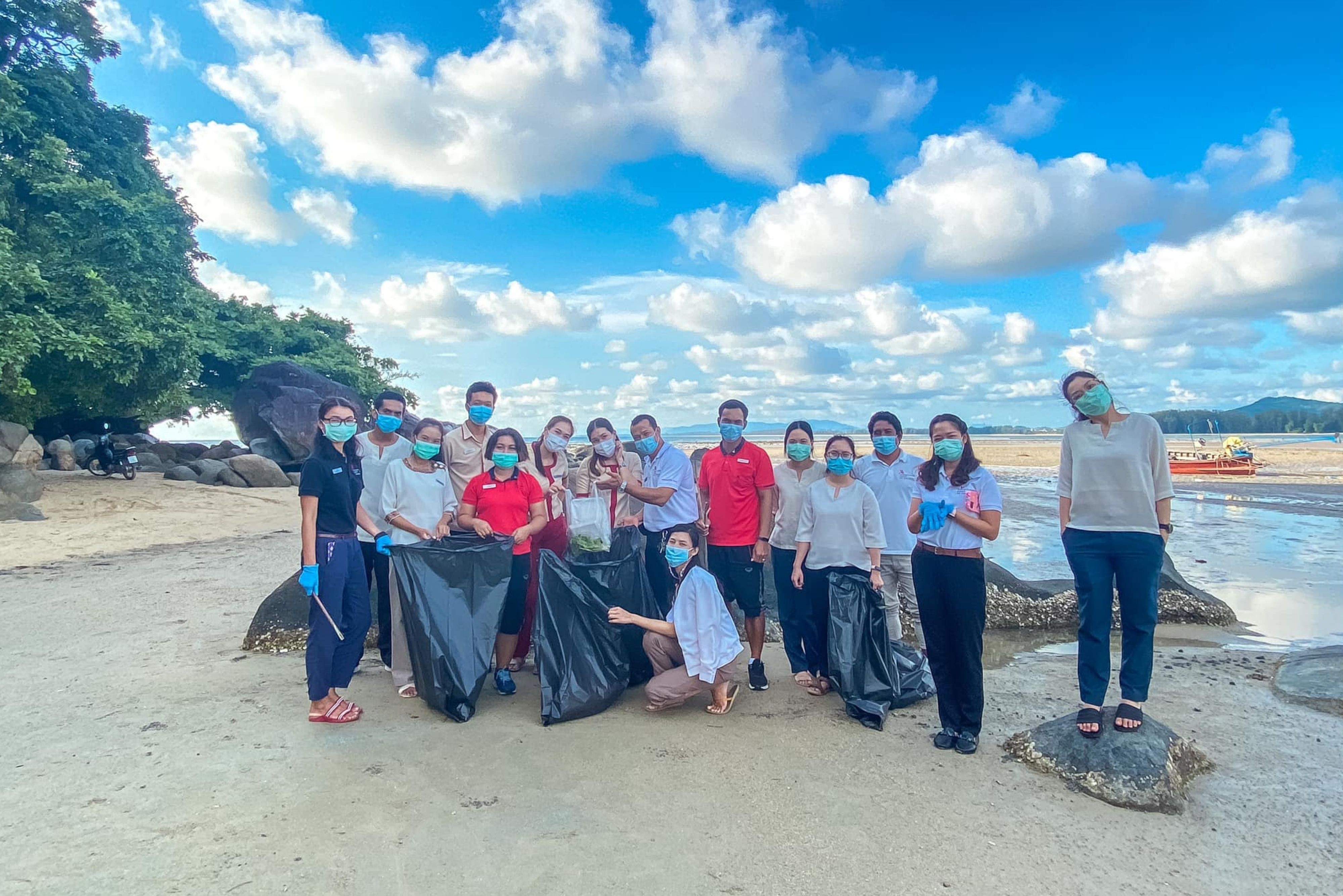 People picking up litter on the beach