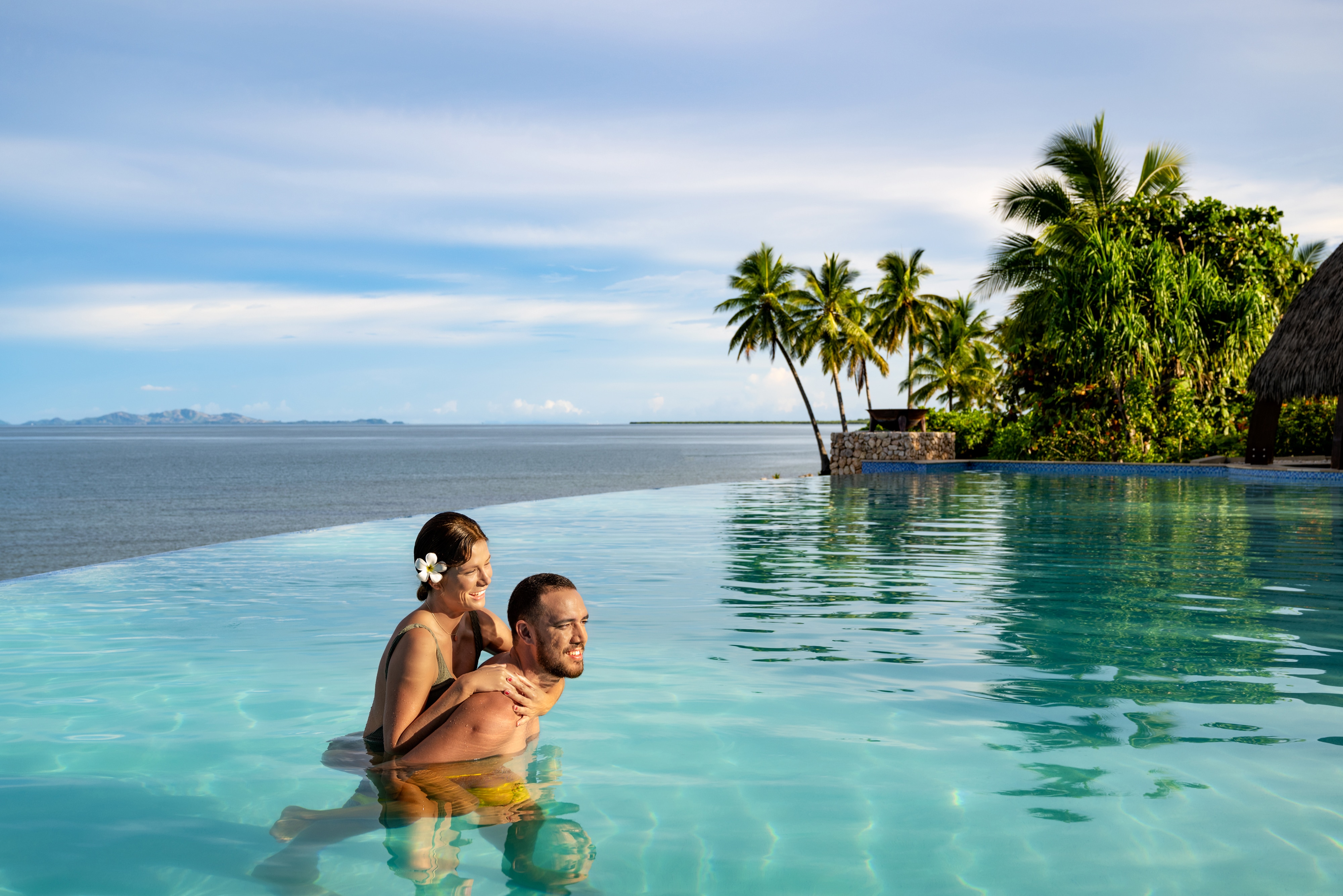 Two people in an infinity pool