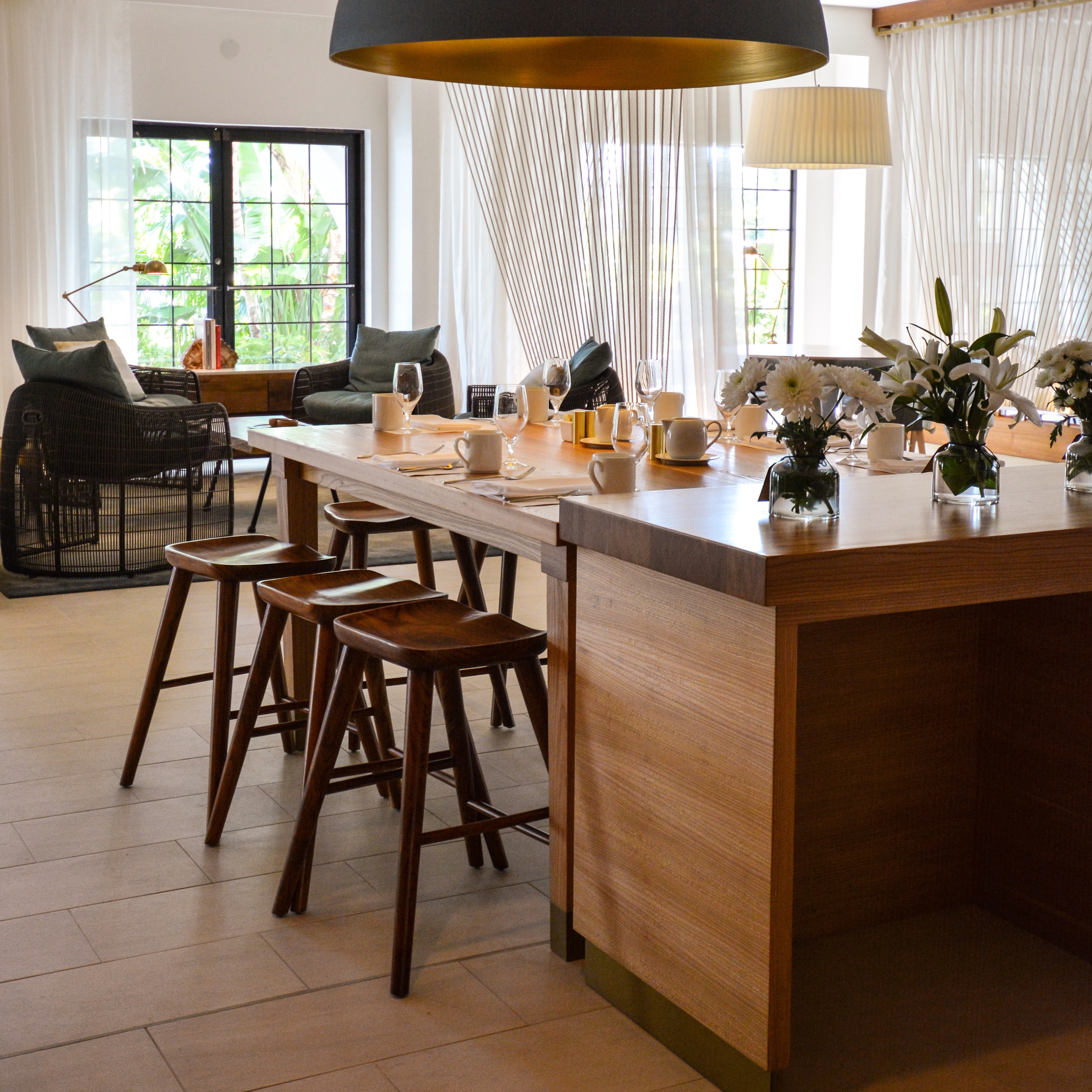 Anchor & Den dining area with flowers