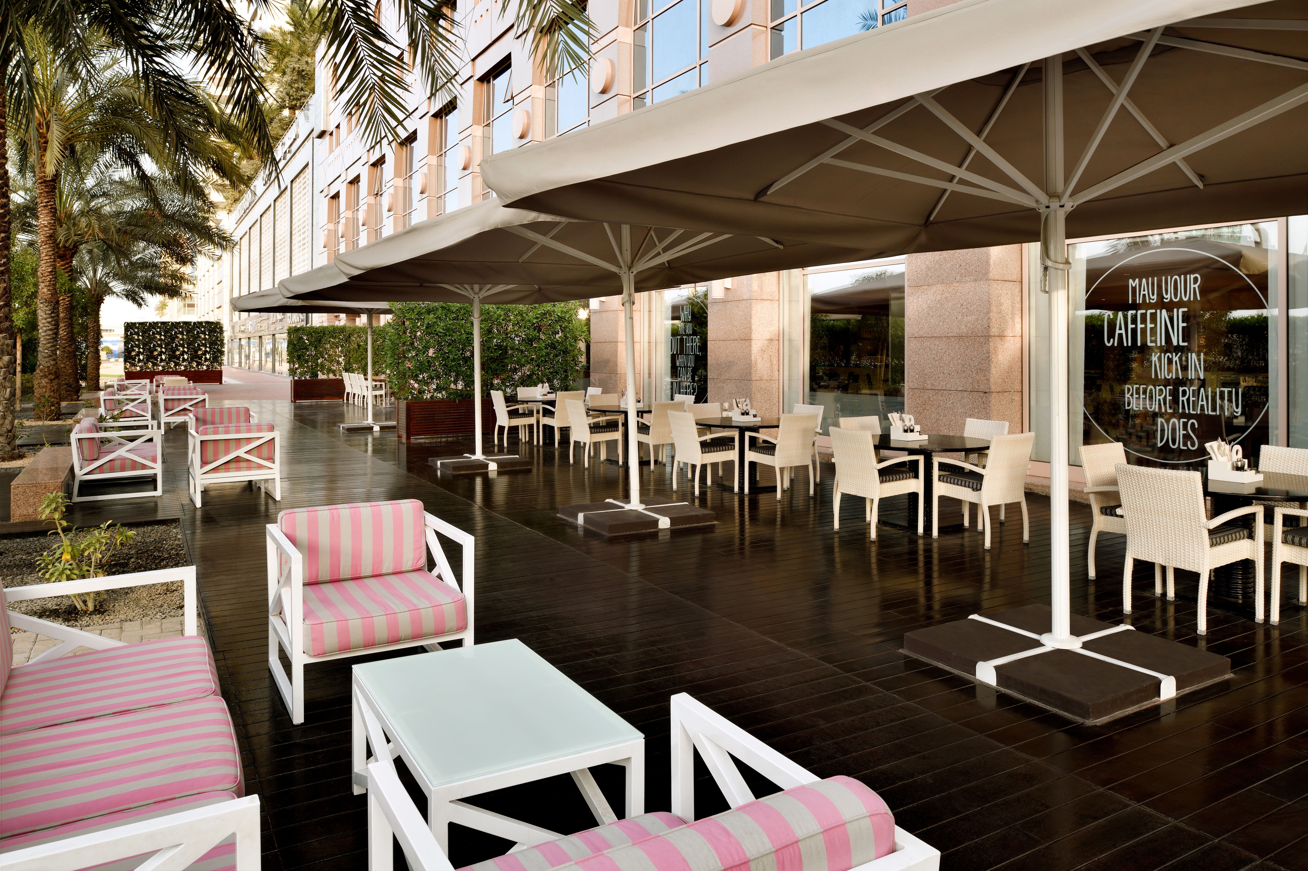 Pink striped chairs on dining terrace