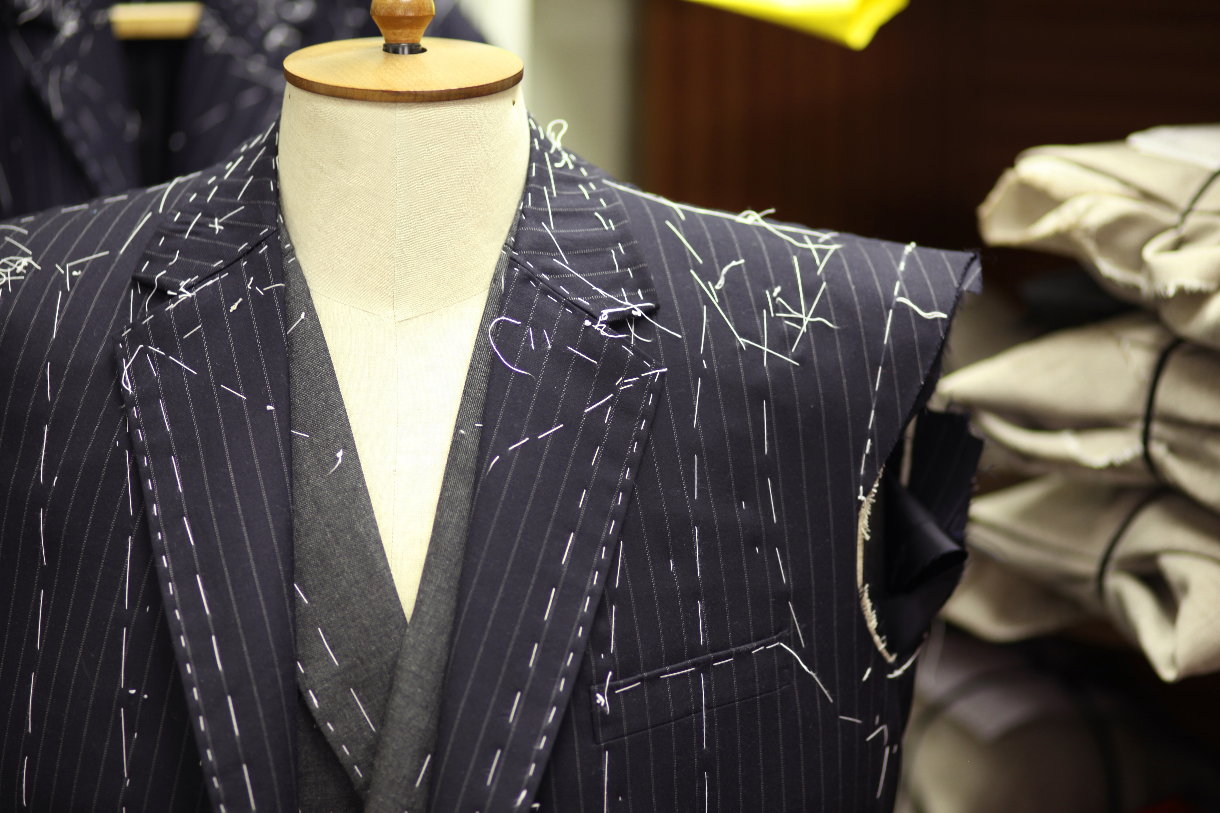 A tailored suit jacket on a mannequin