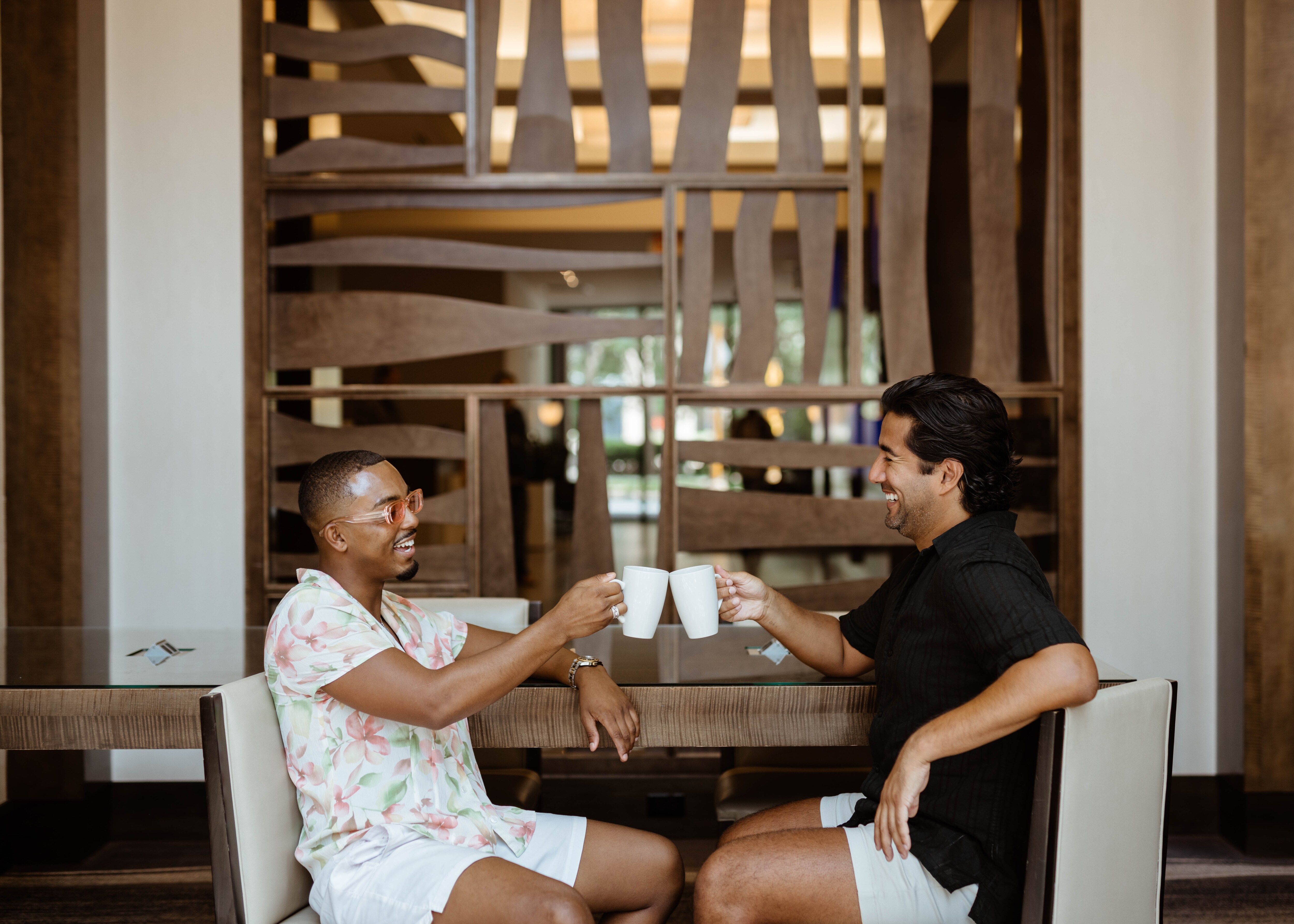 Two men toasting coffee