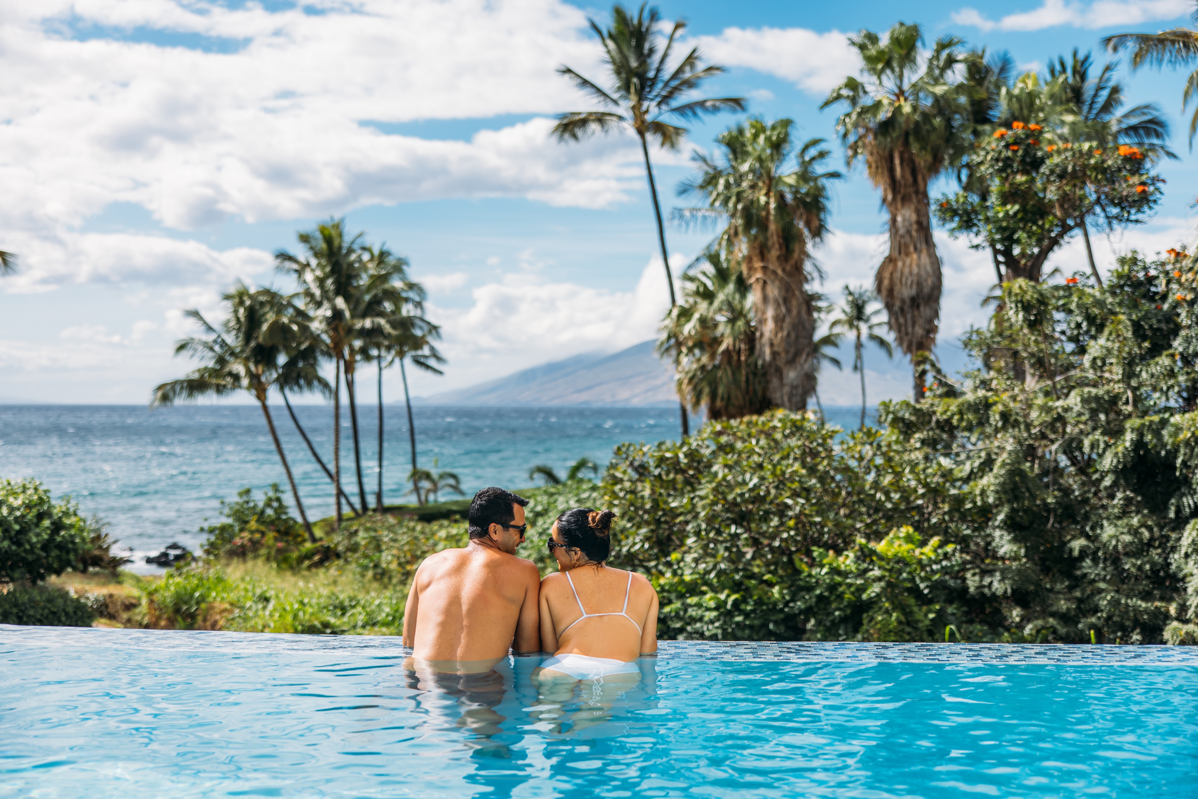 Couple swimming in outdoor swimming pool