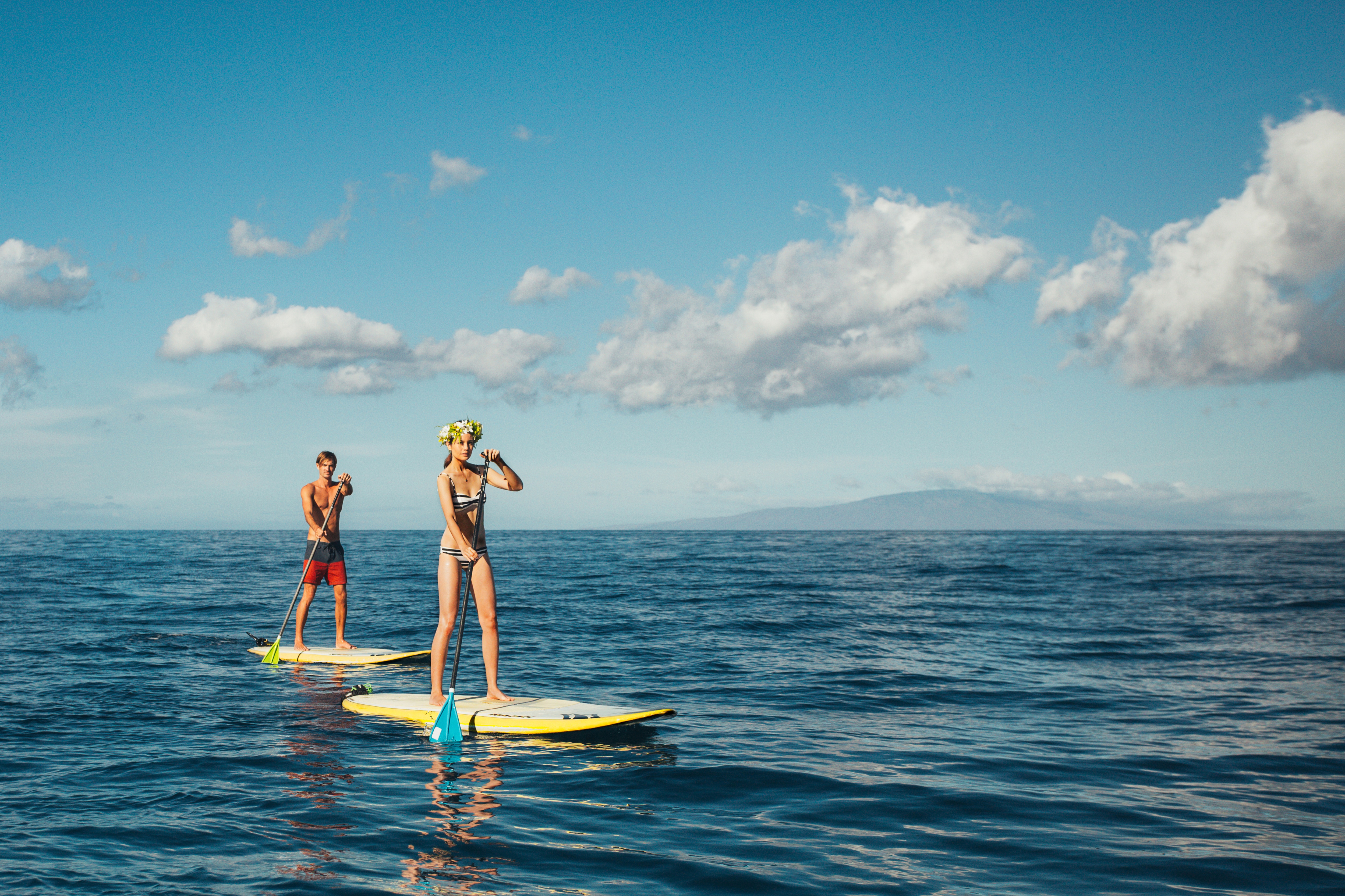 people on paddle board