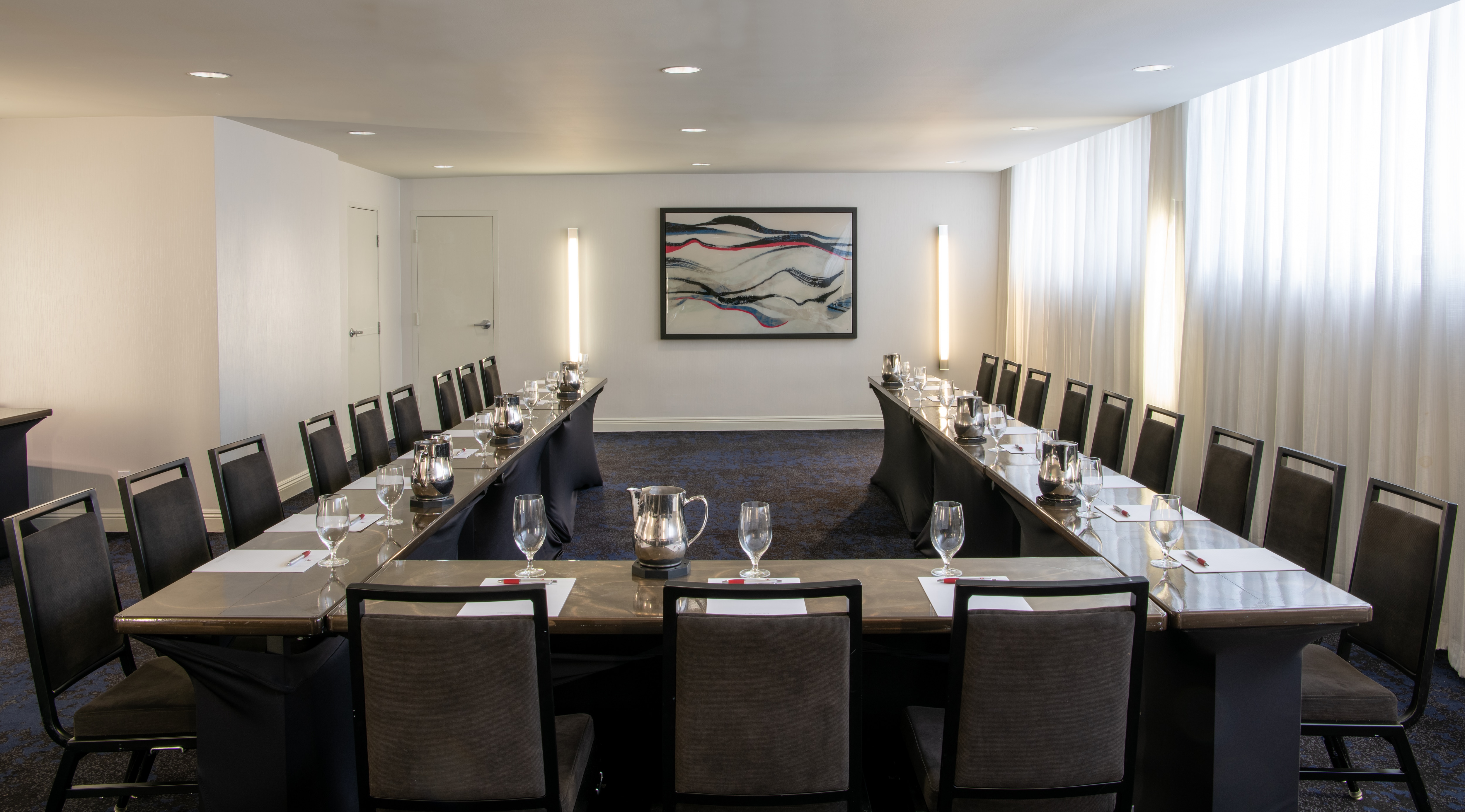 Meeting room with u-shape table setup