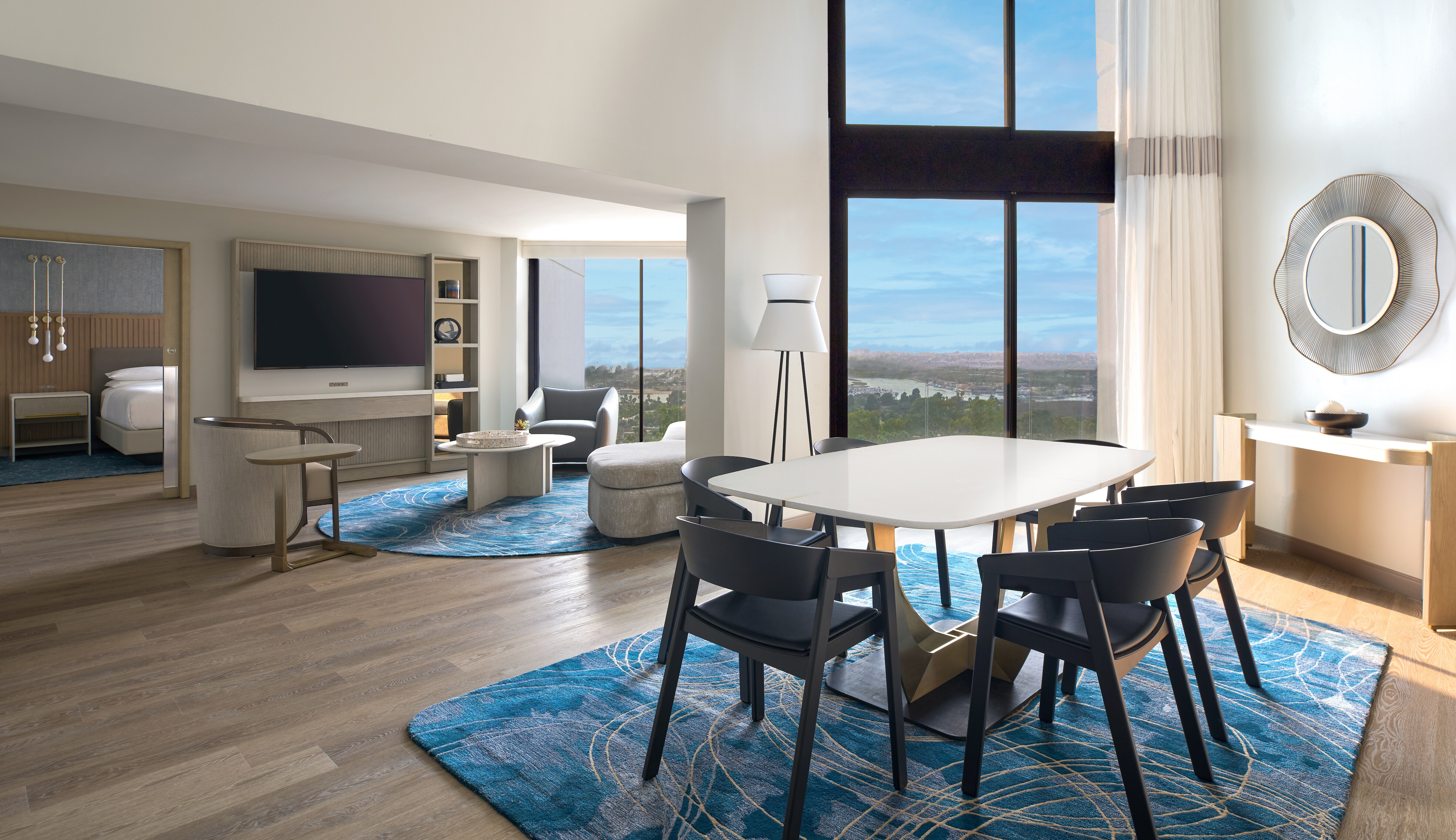 Guest suite living area with large windows and exterior views