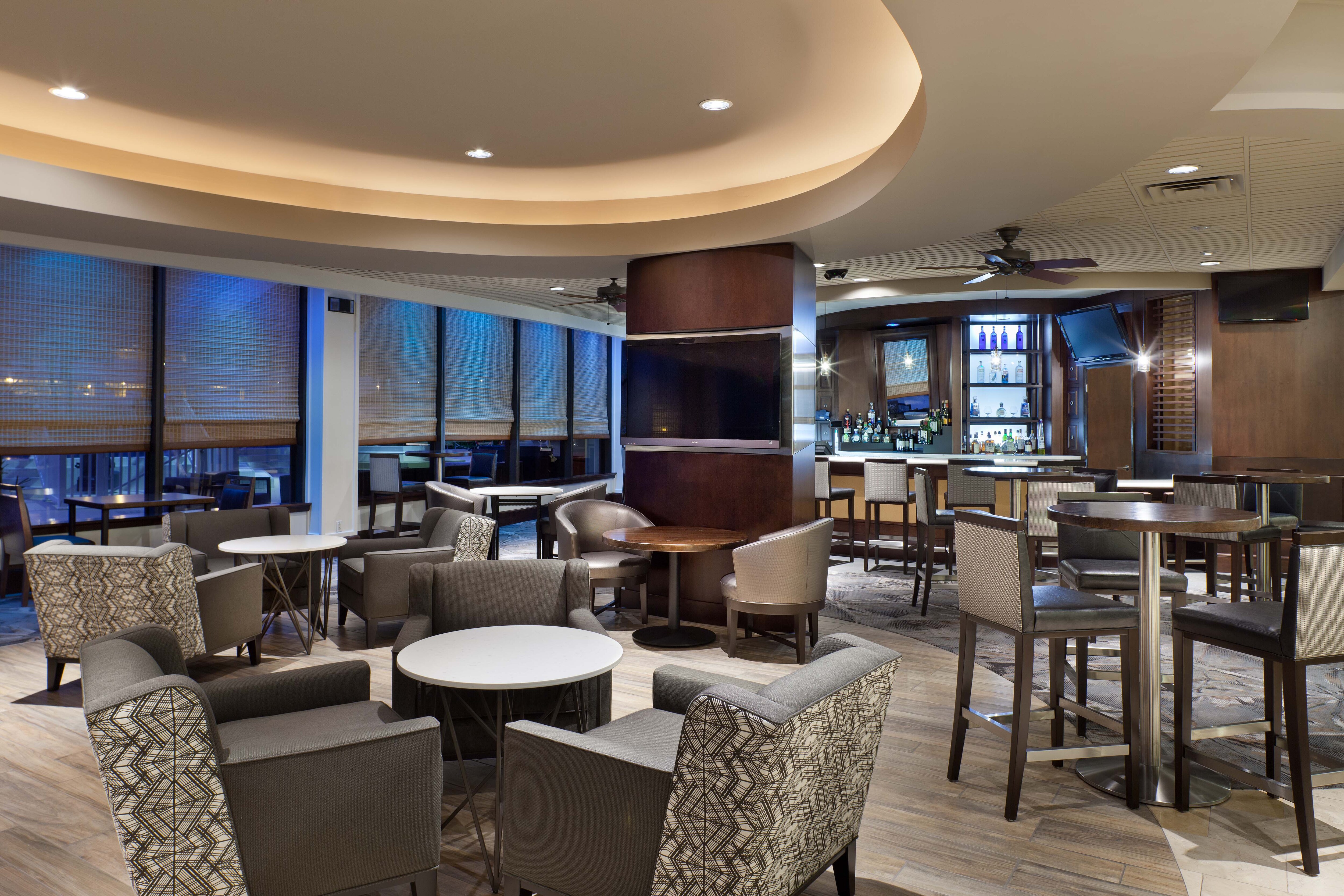 Skyye Lounge seating with tv and bar