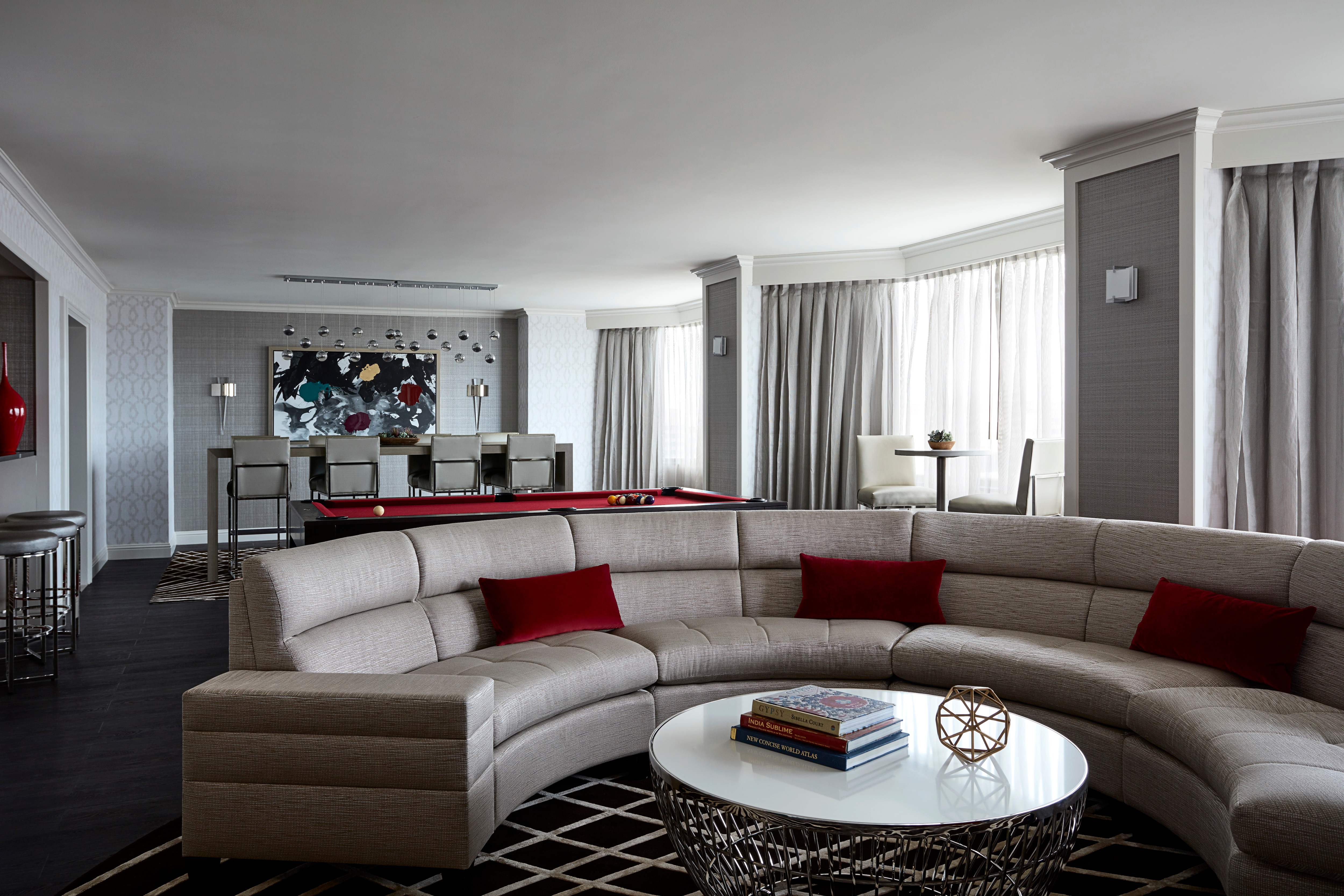 Living area with semicircular sofa and round table