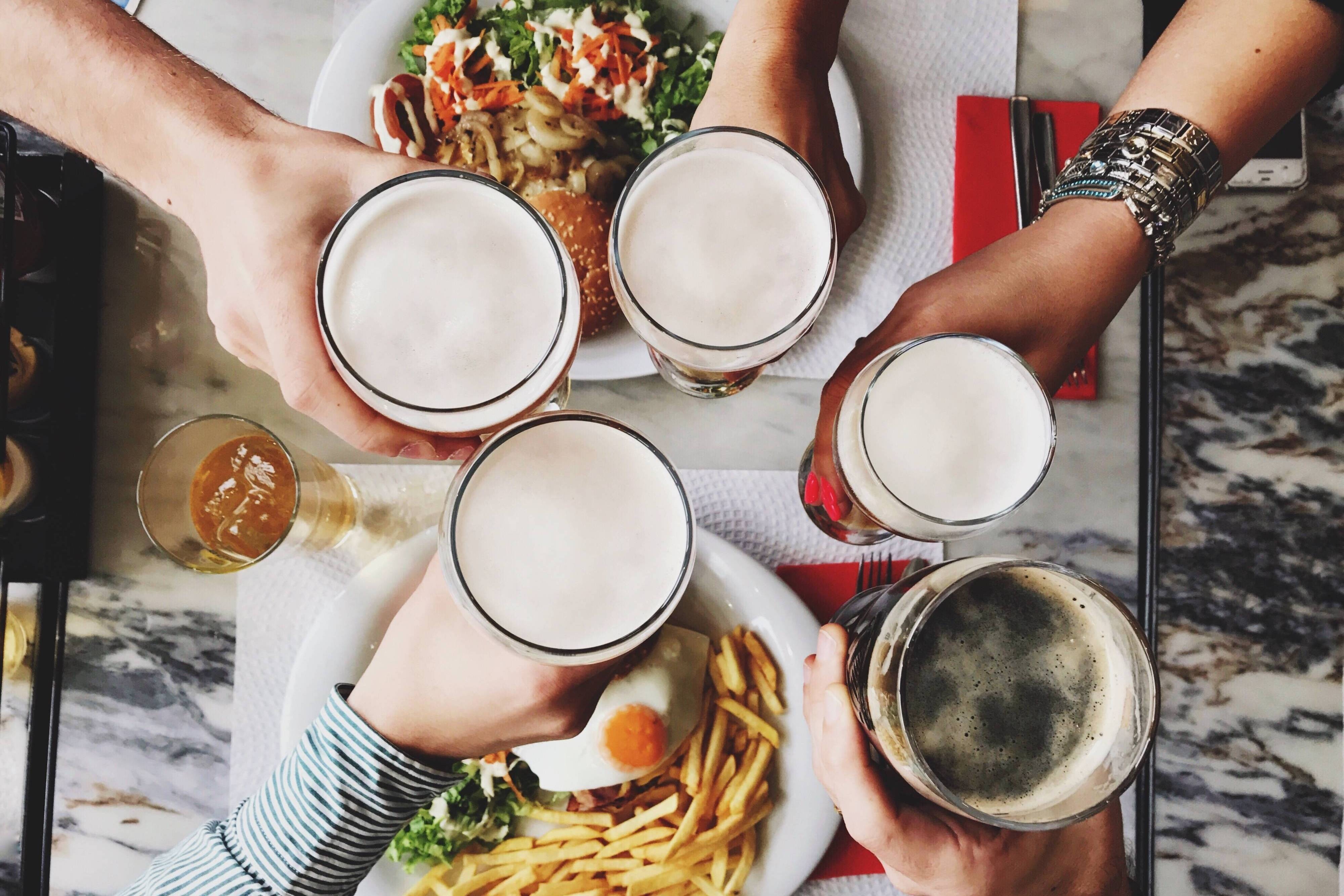 People toasting with drinks