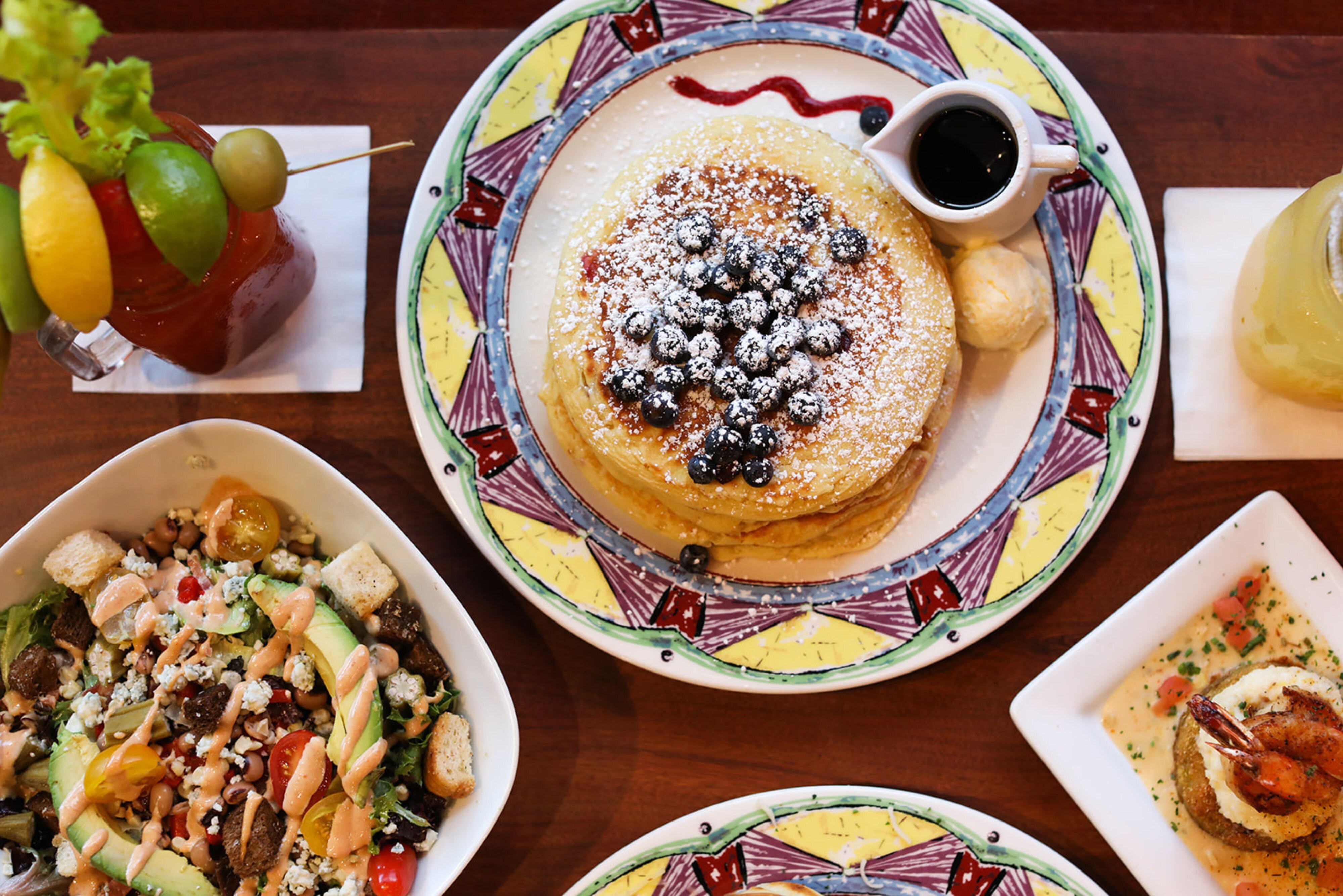 Breakfast spread including pancakes and fruit