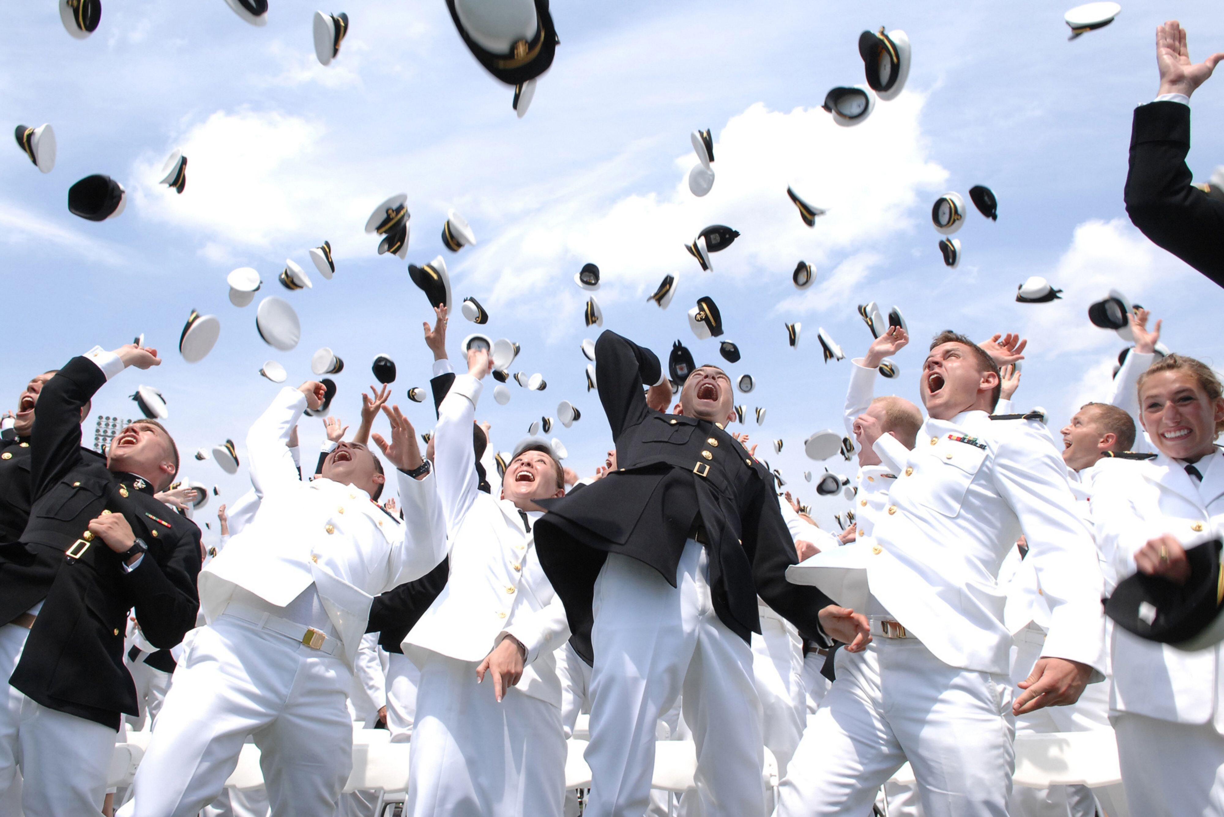 USNA Grads throwing caps in air
