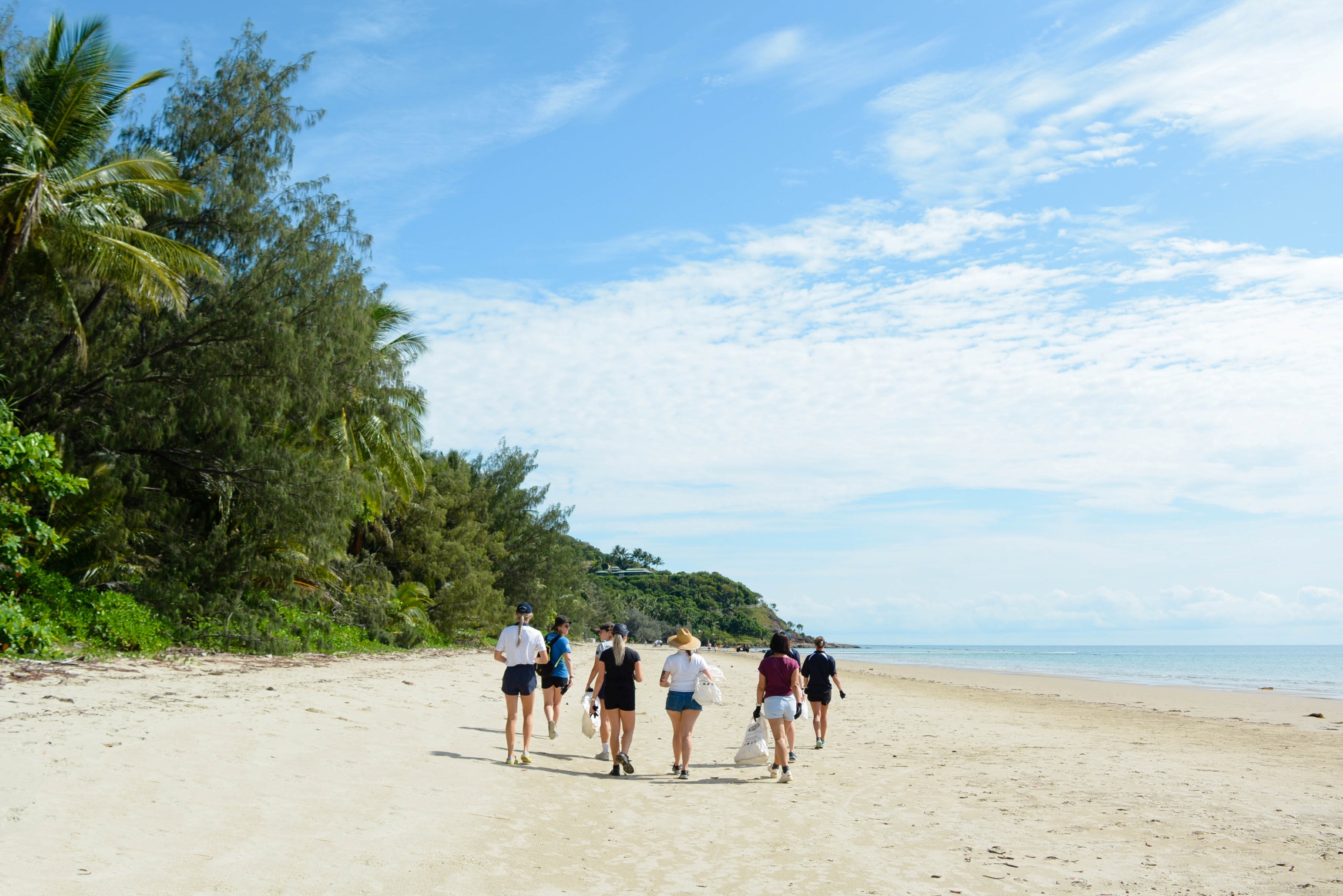 People walking on beach.
