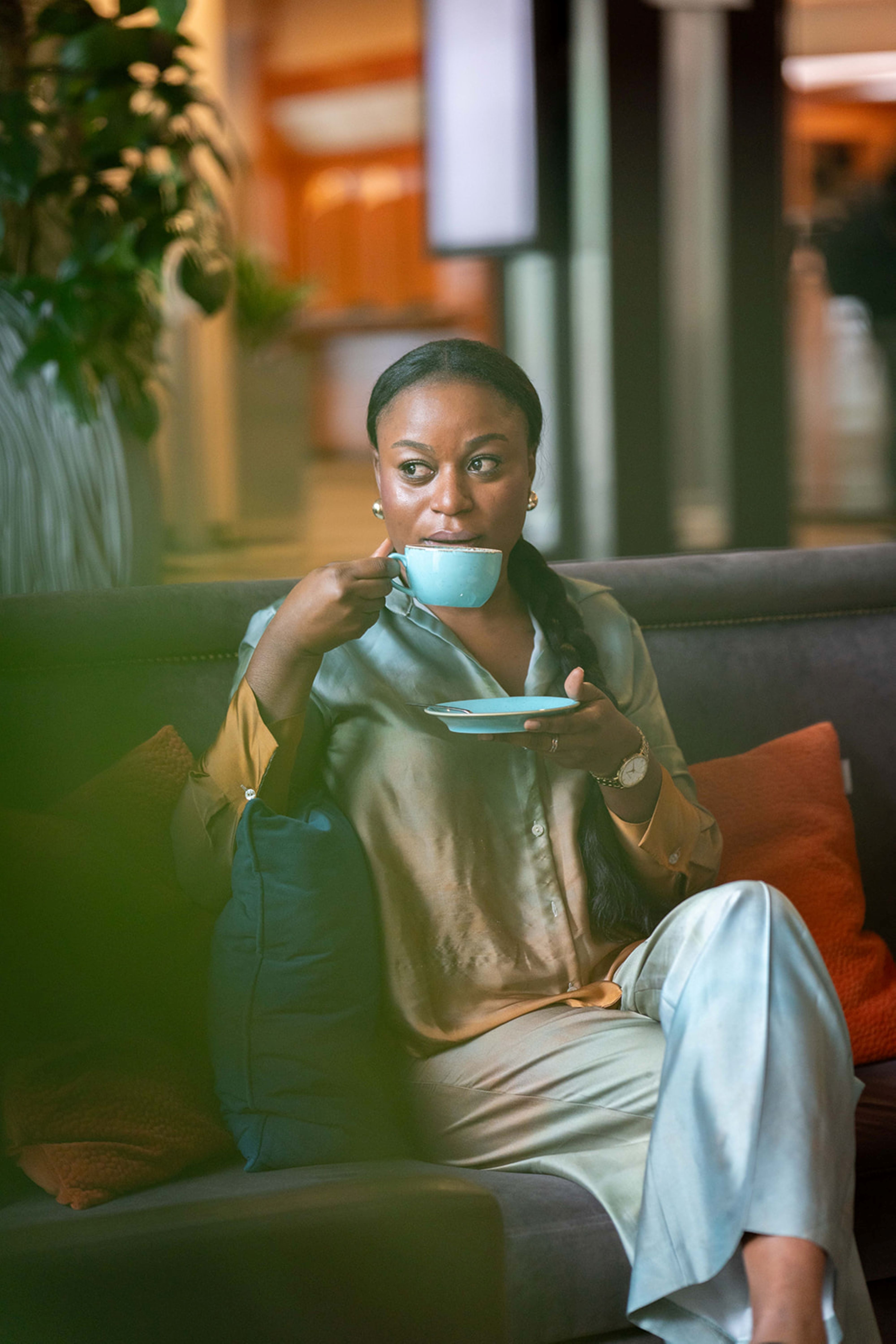 Person having coffee in hotel lobby