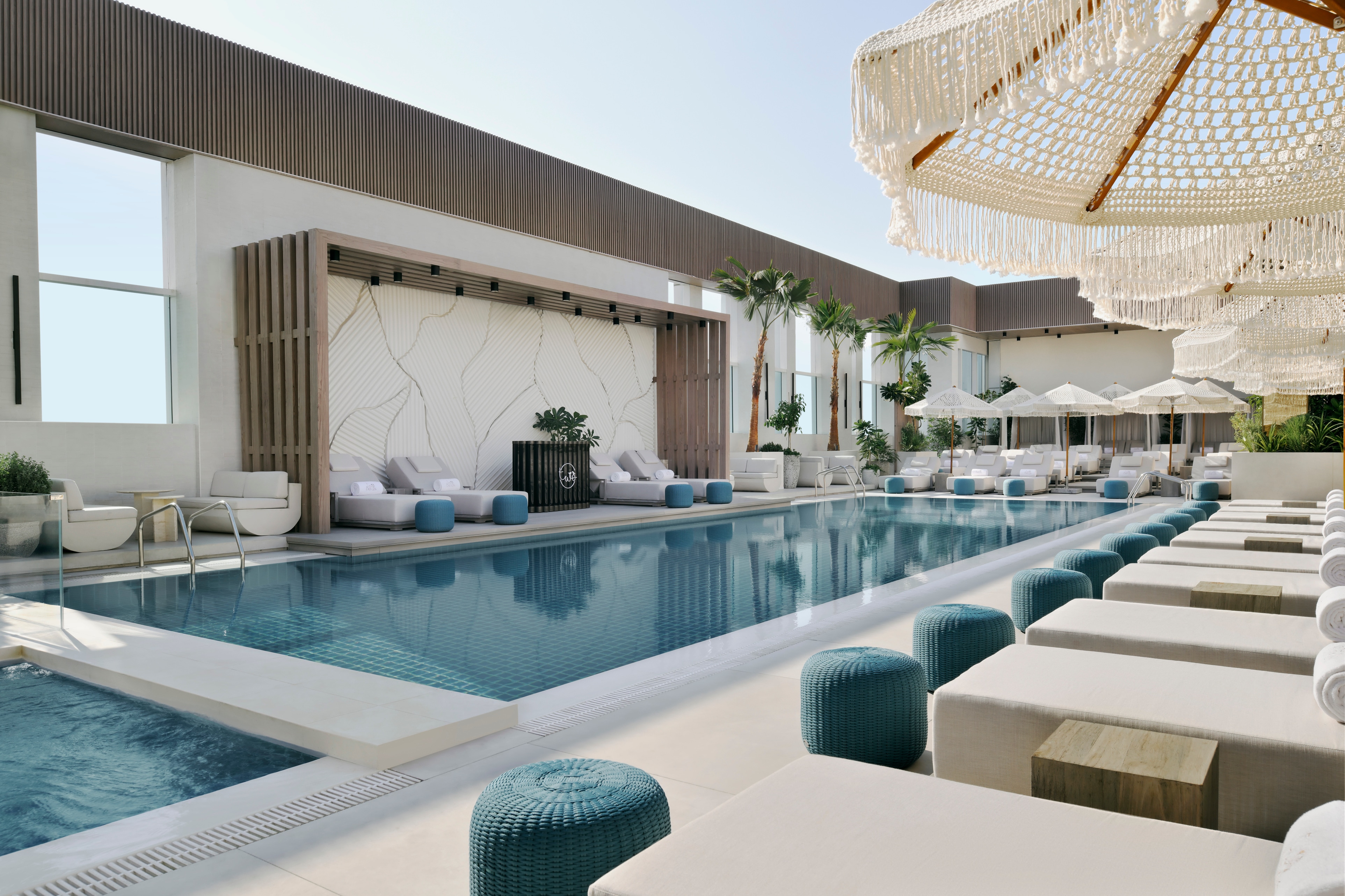 Rooftop Pool, lounge chairs, umbrellas