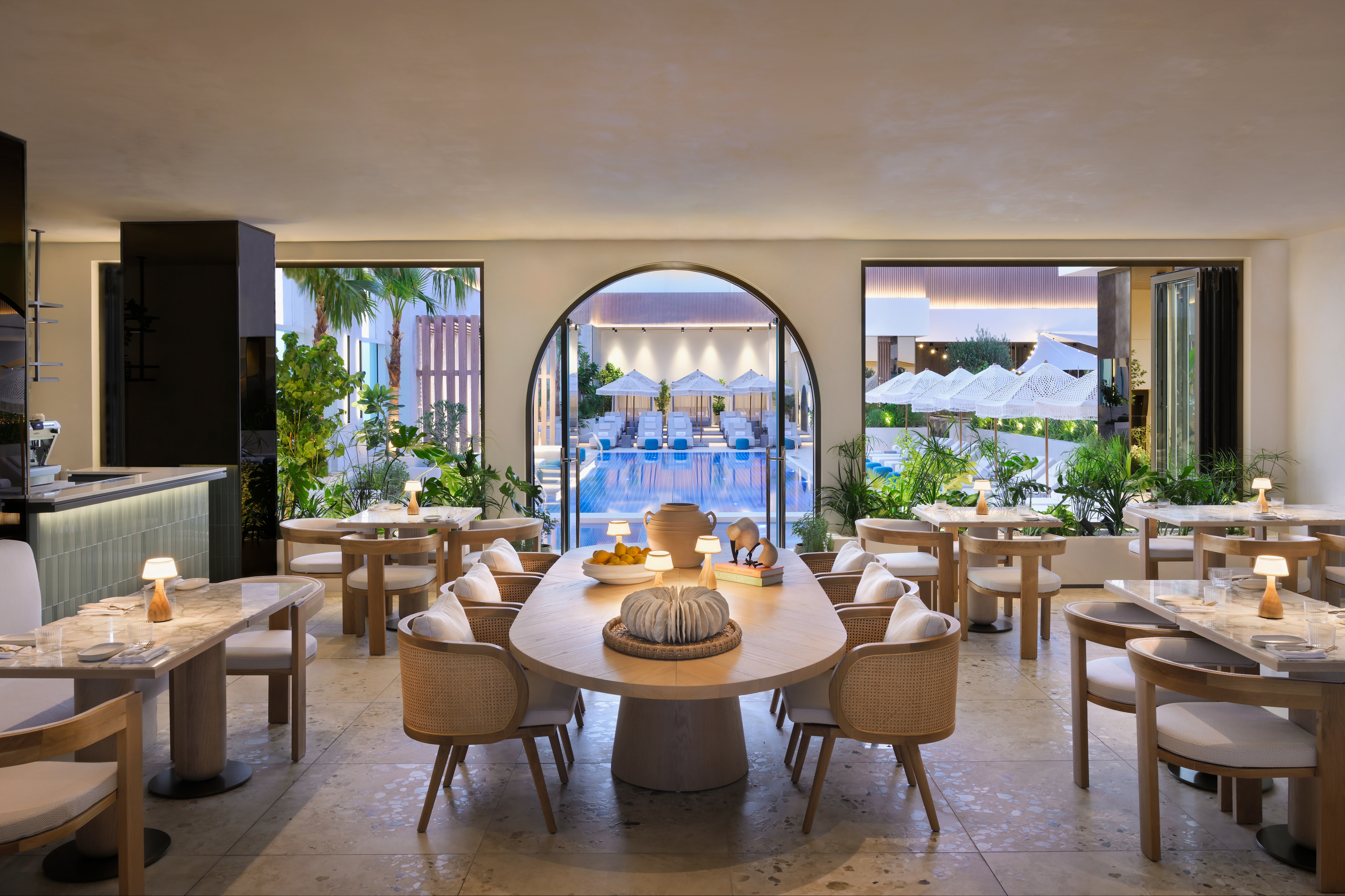 Diningroom opening to a pool area.
