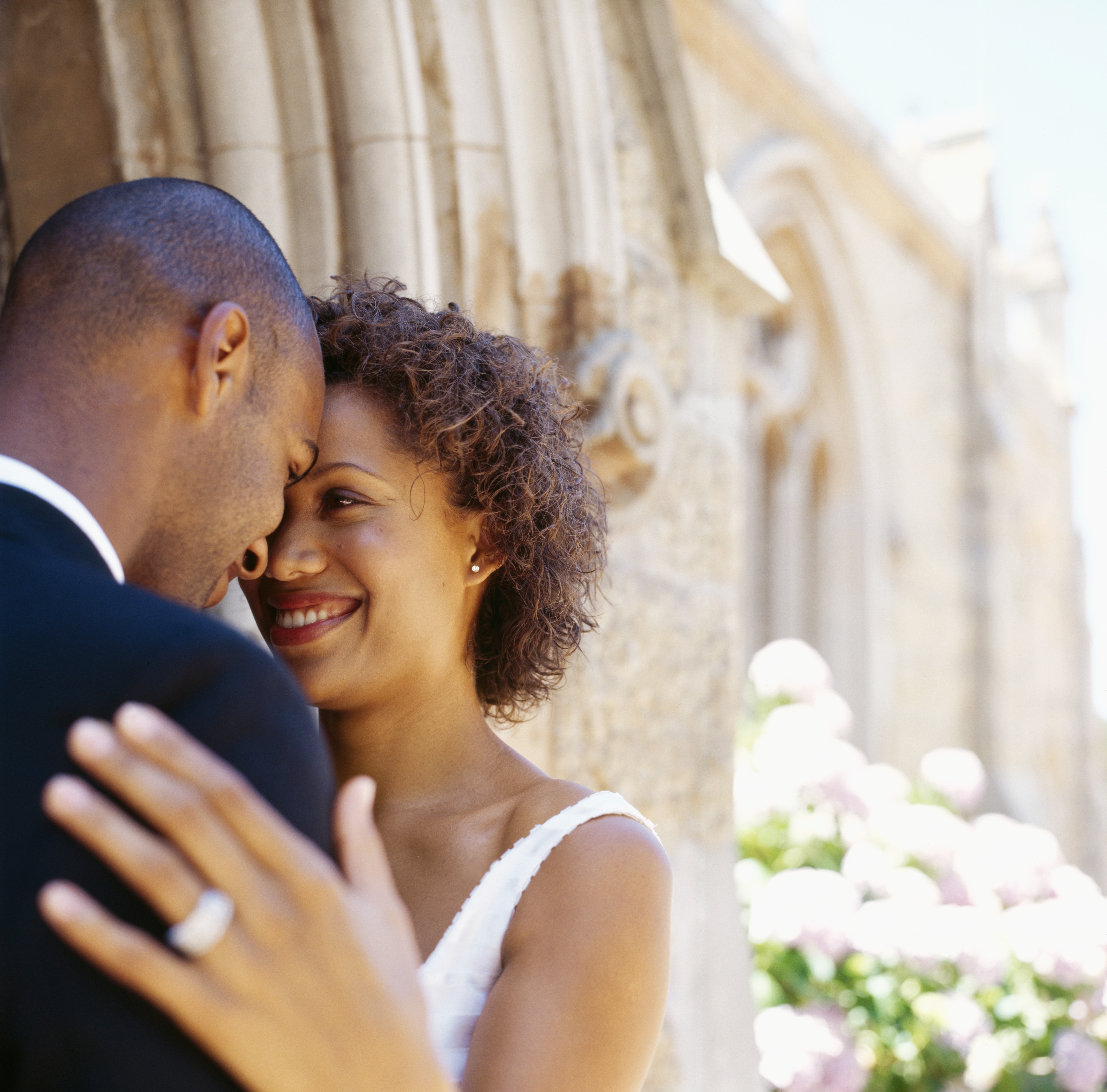 Newlywed couple looking at each other