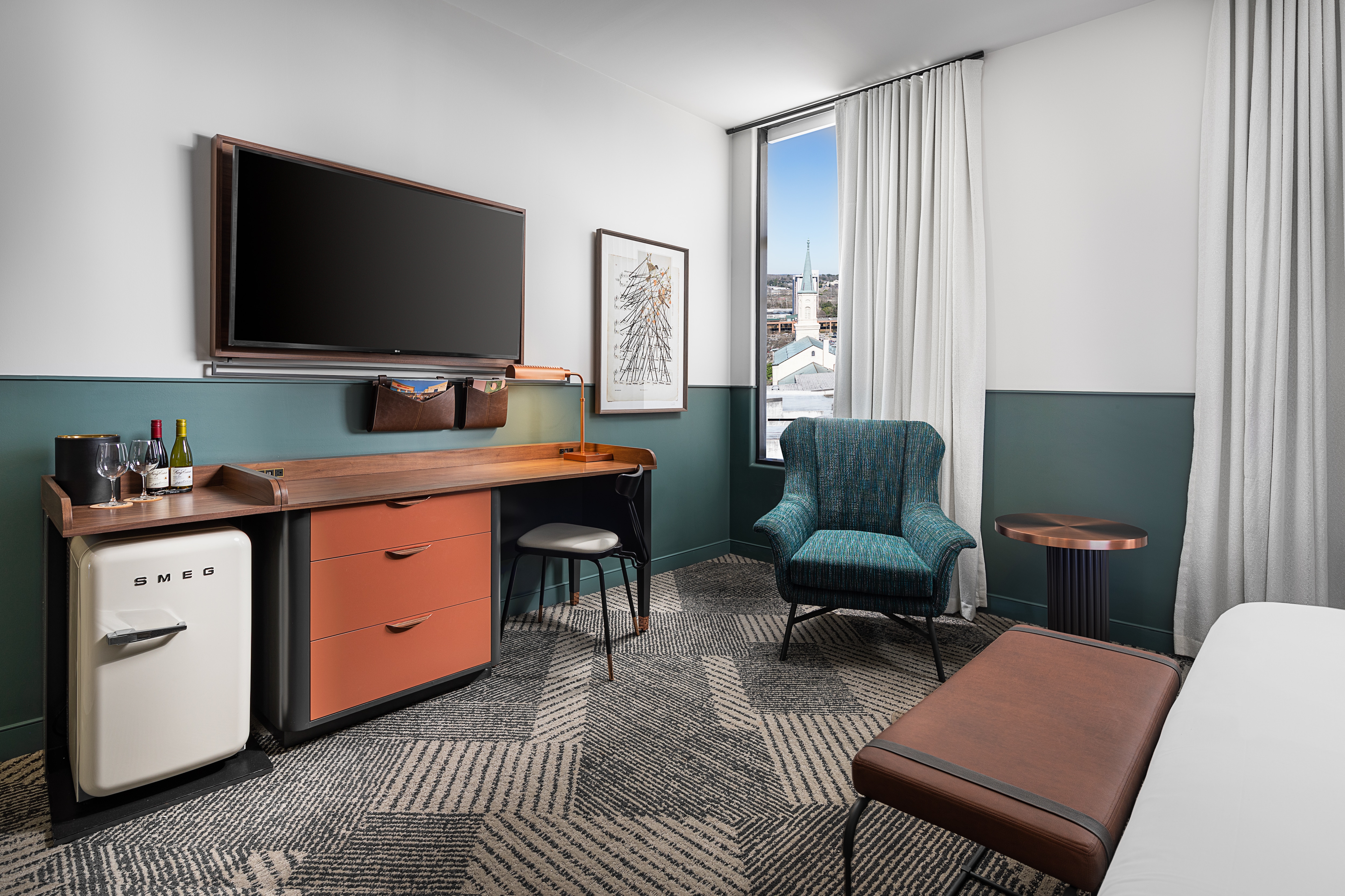 Guestroom desk and tv with city view