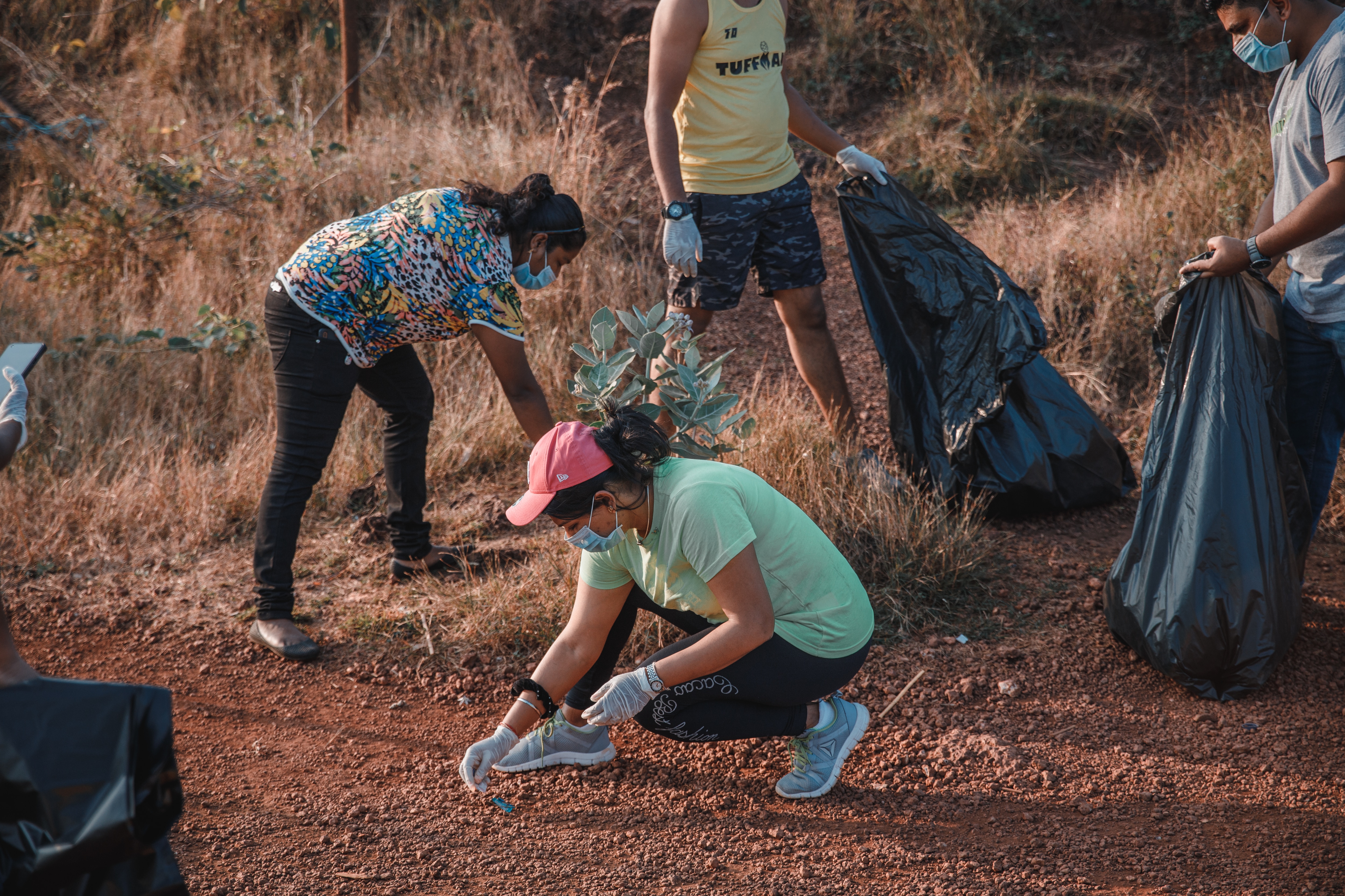 People picking up litter.