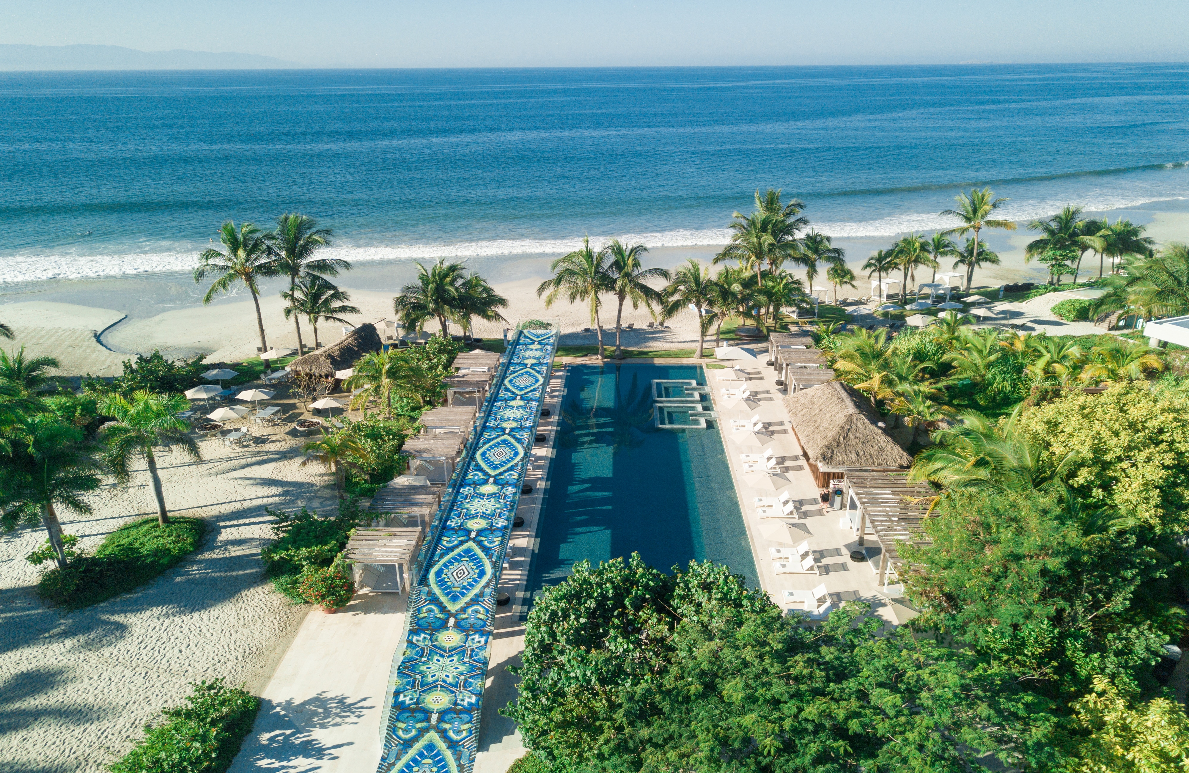 hotel pool surrounded by beach