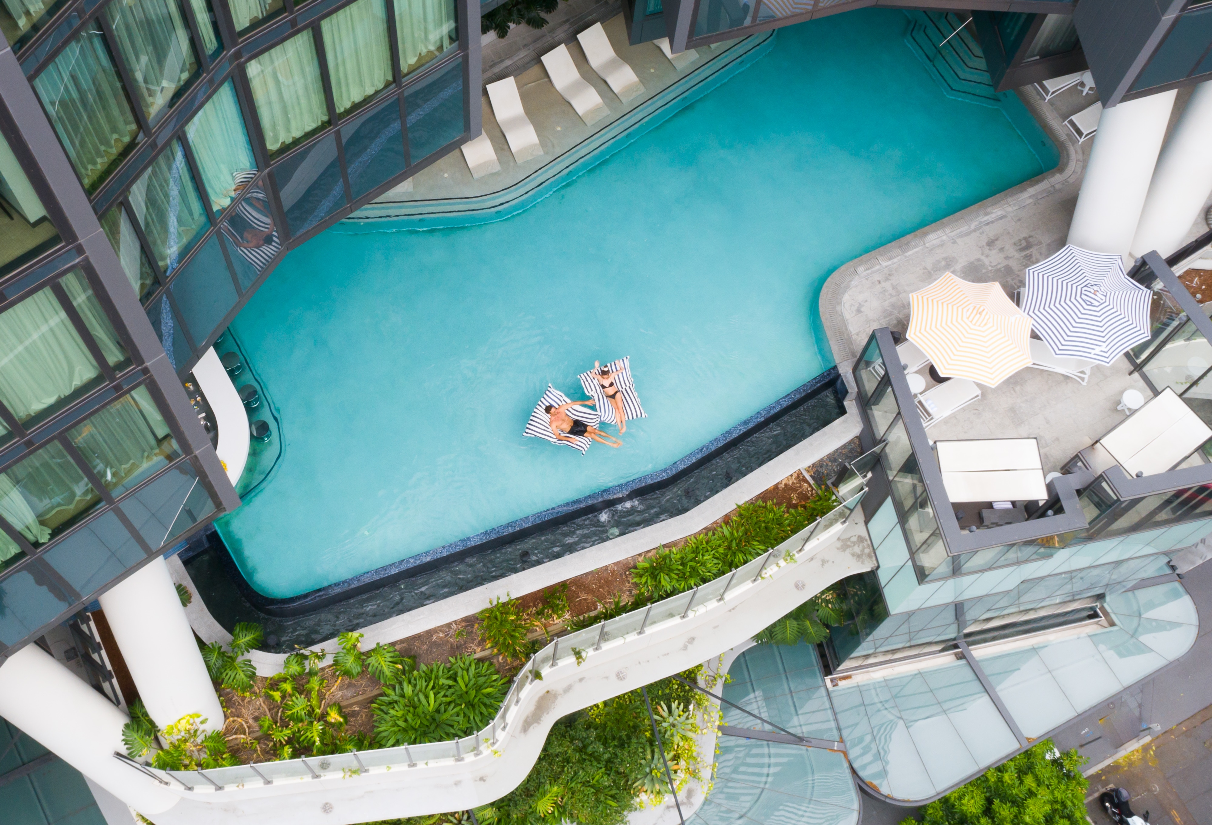 Aerial view of couple in a pool