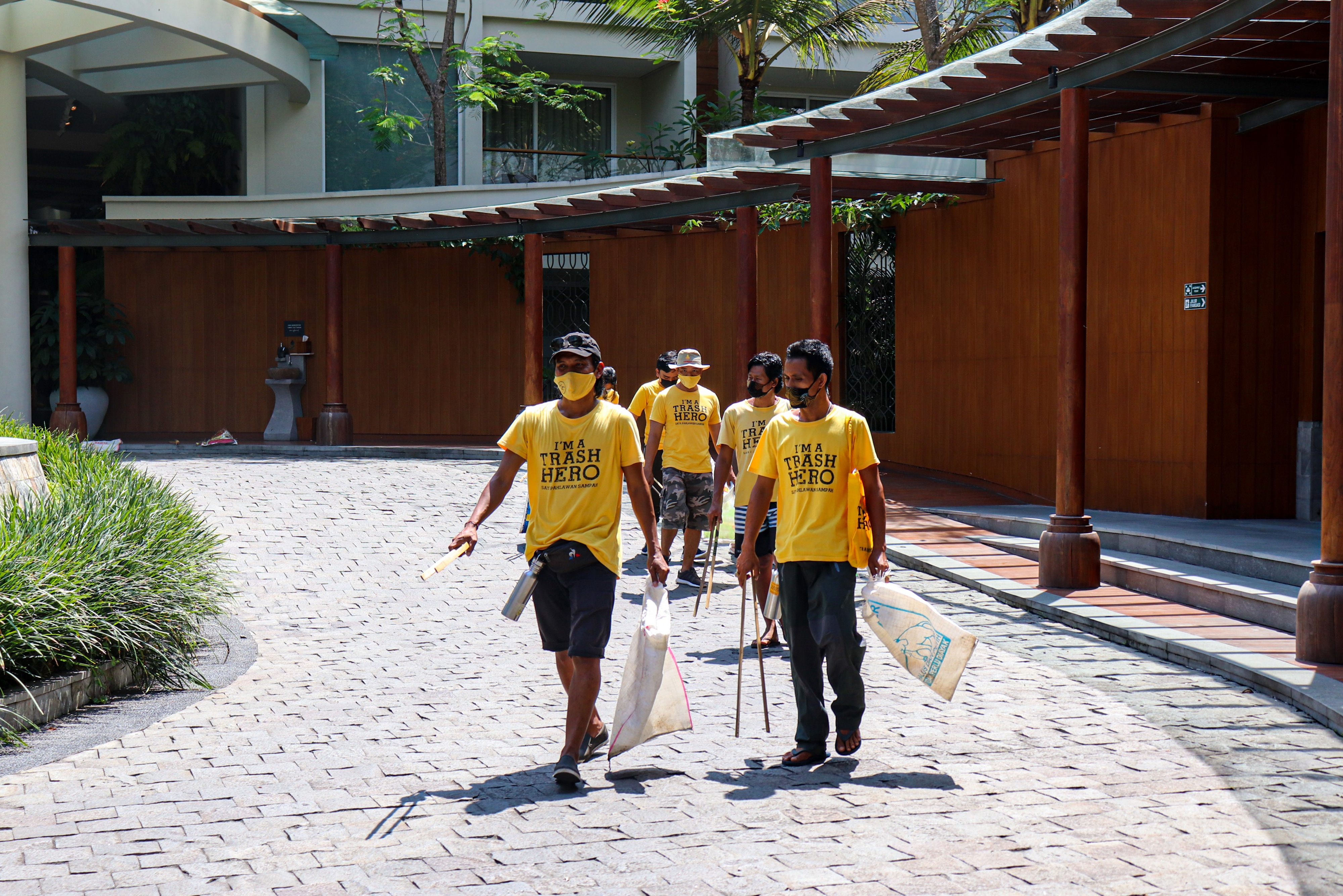 Trash Hero volunteers walking outside the hotel