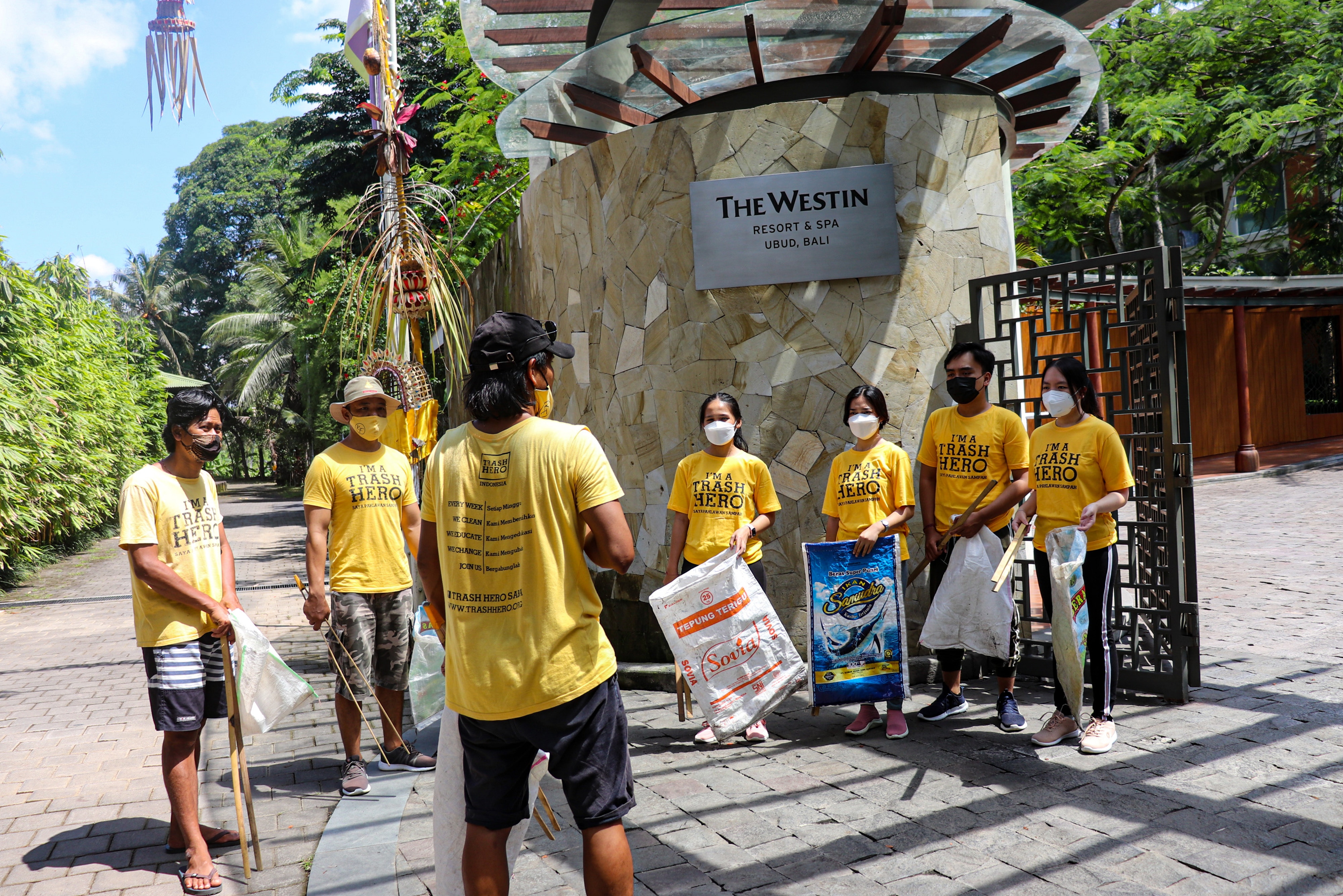 Group of Trash Hero volunteers outside the hotel