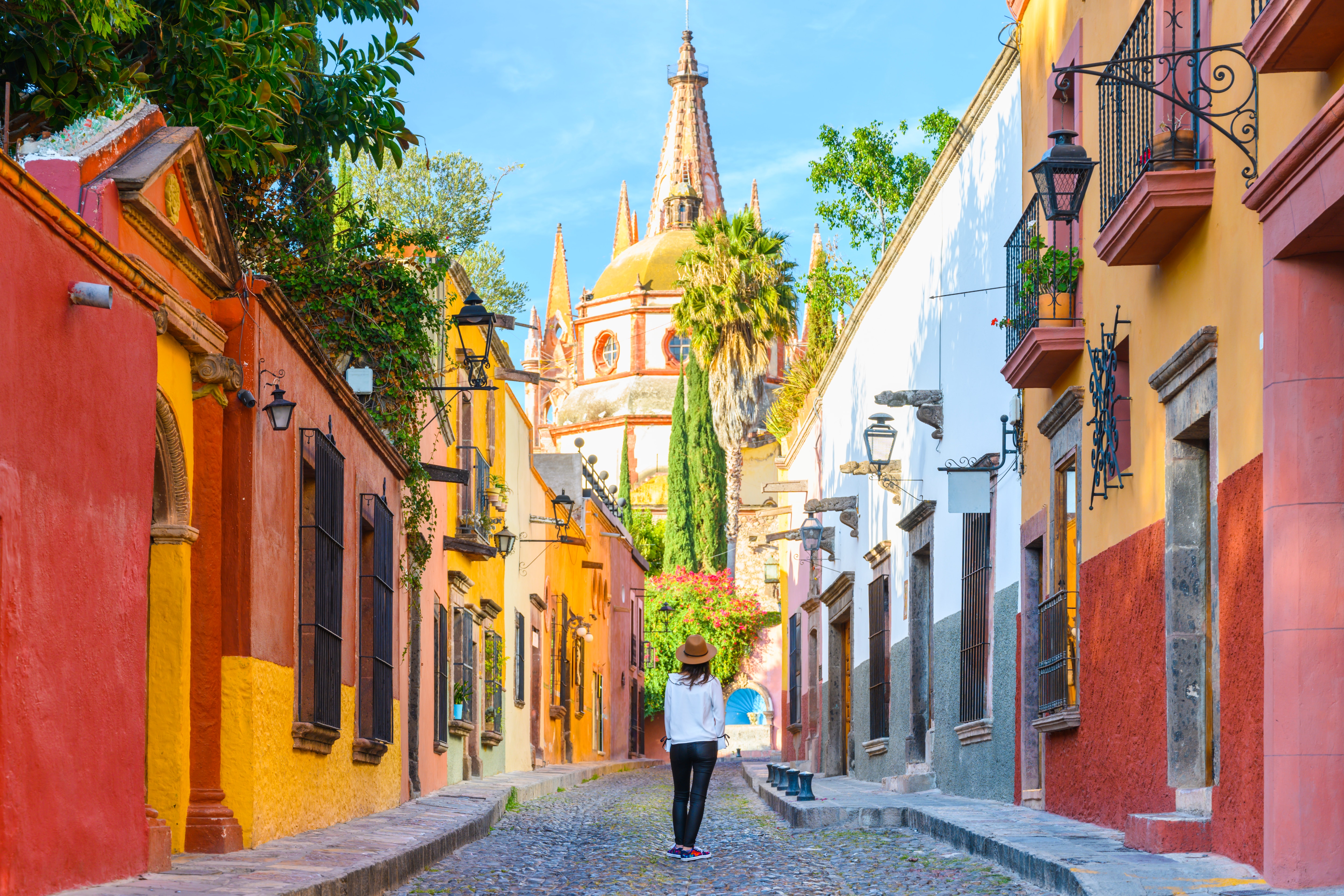Tourist walking through San Miguels street