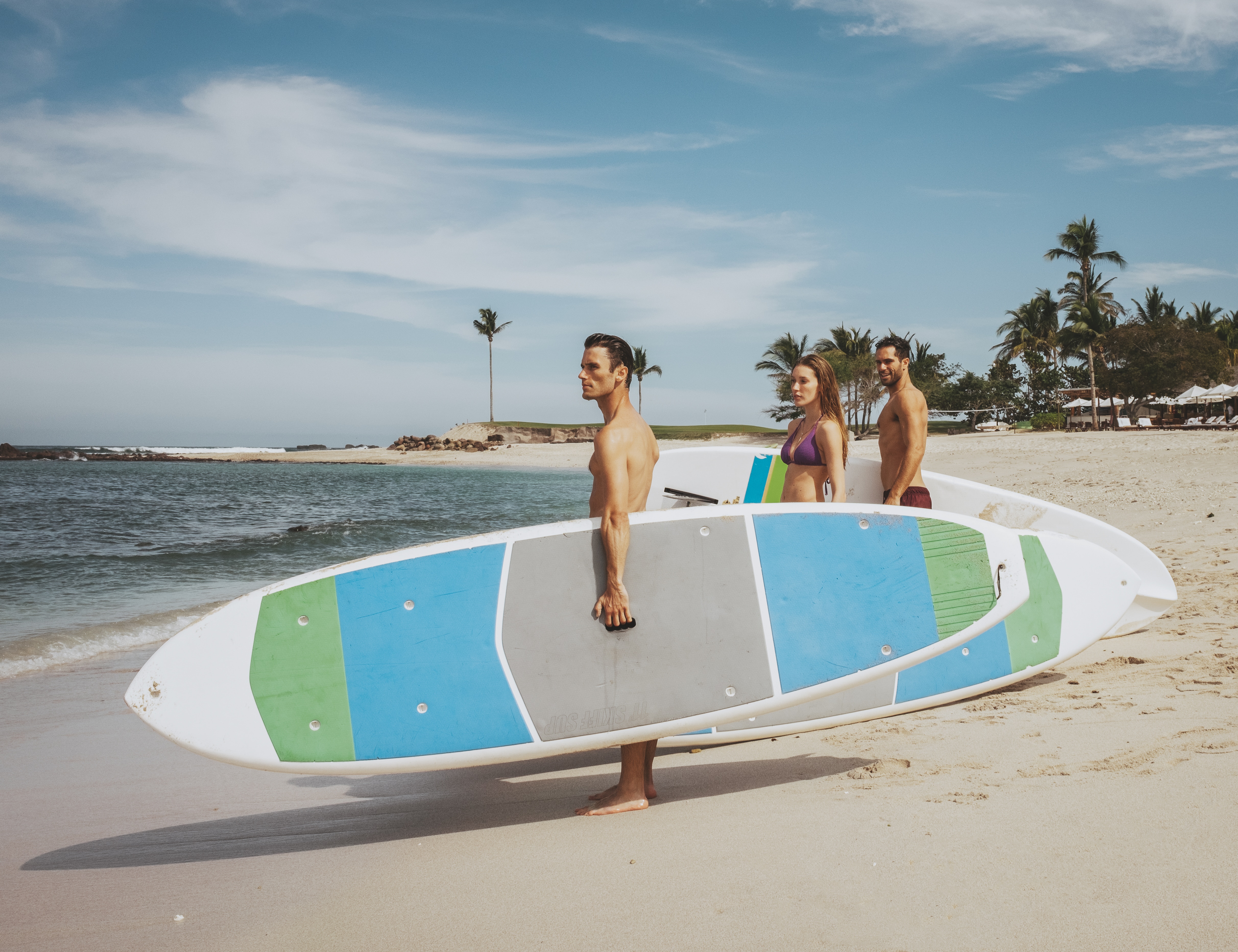Friends paddle boarding
