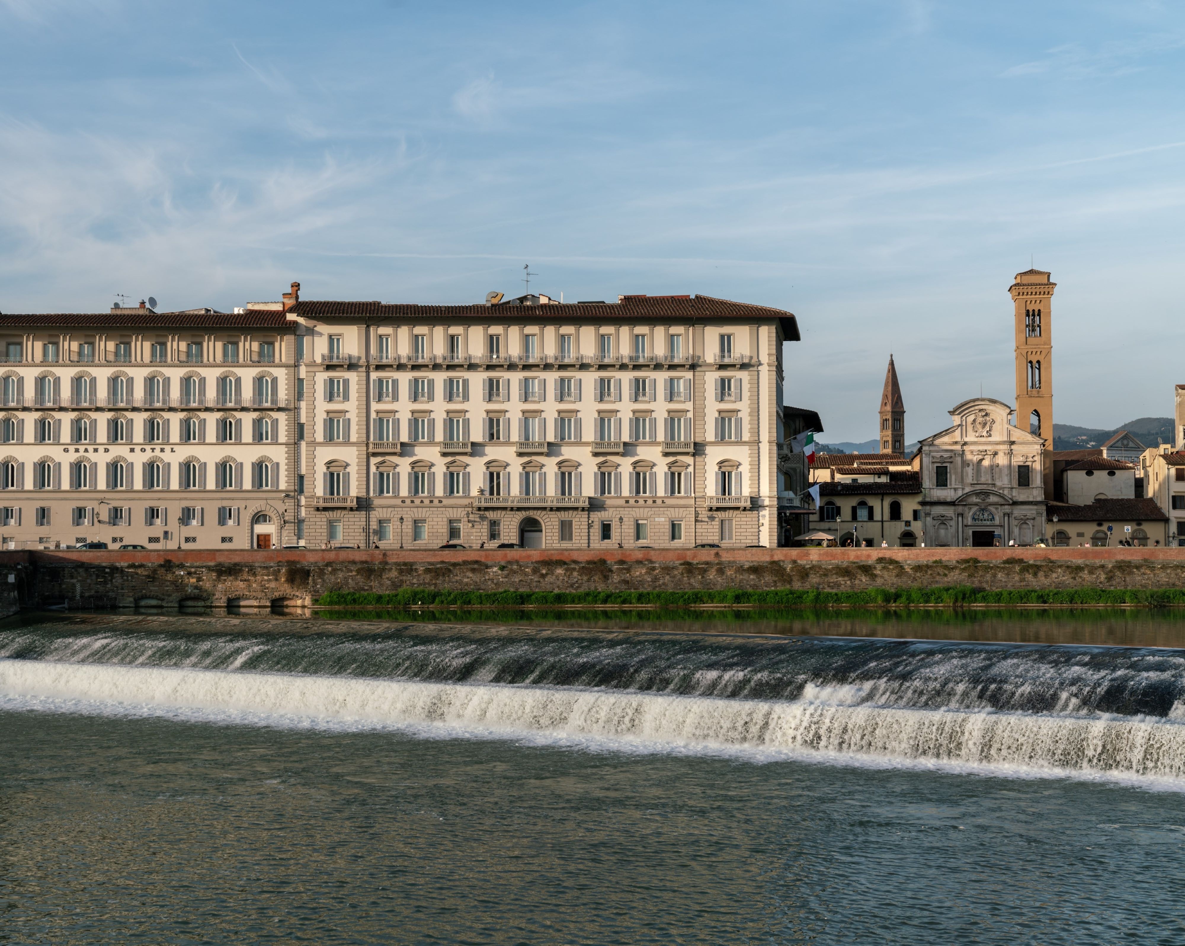 The hotel standing on the banks of the river