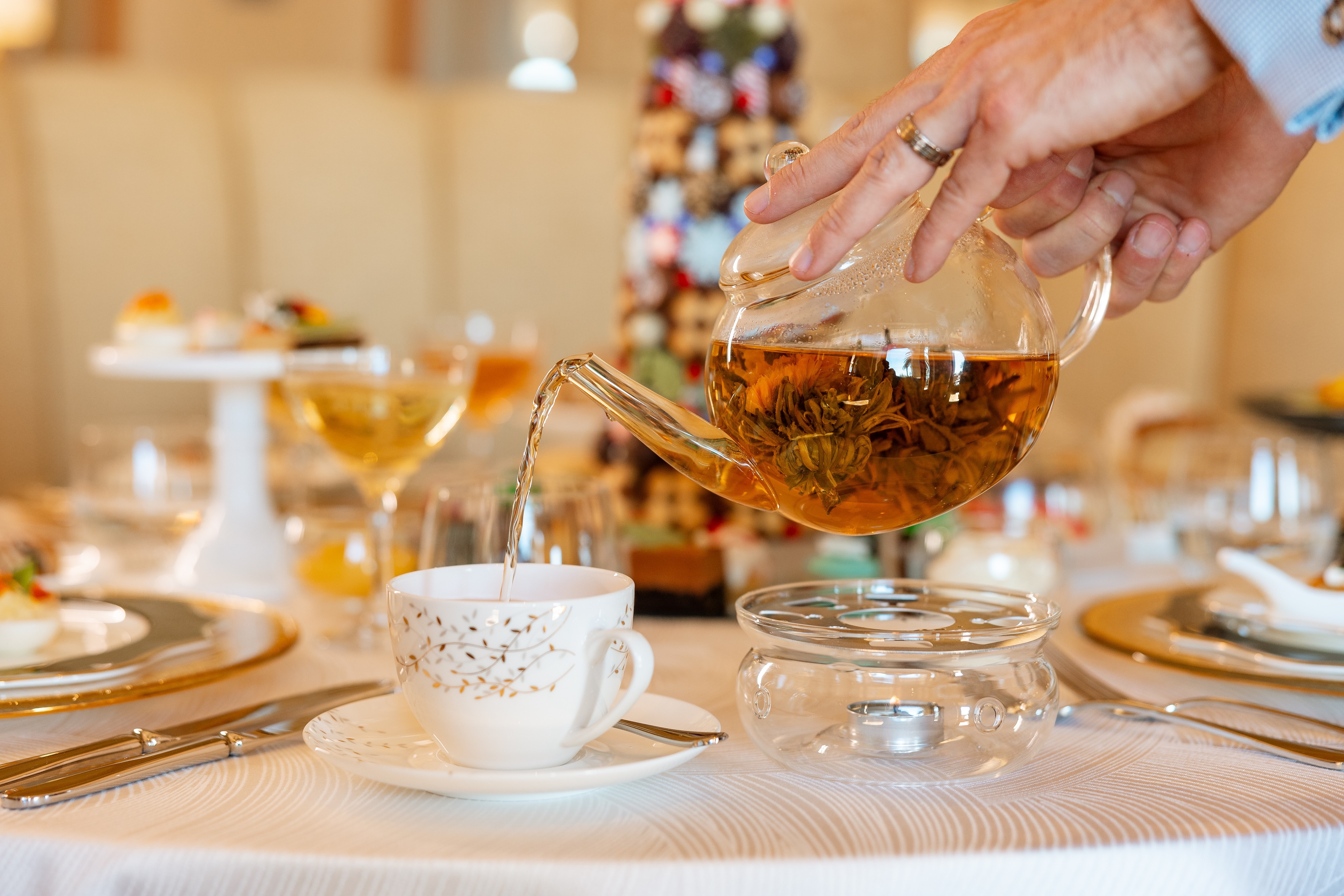 High tea table set up with plates and tea pots