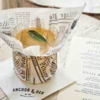 Cocktail wrapped in decorative newspaper