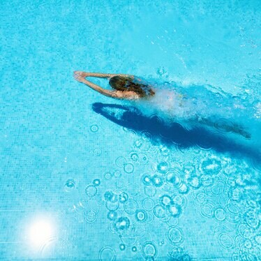 Woman swimming in pool