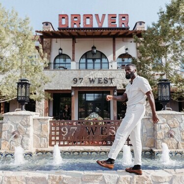 Man walking by a building 