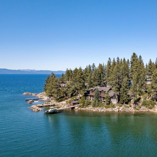 Homes and trees dotted along the Lake Tahoe shoreline