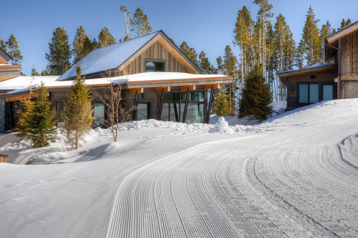 Mountainside cabin home dusted with snow