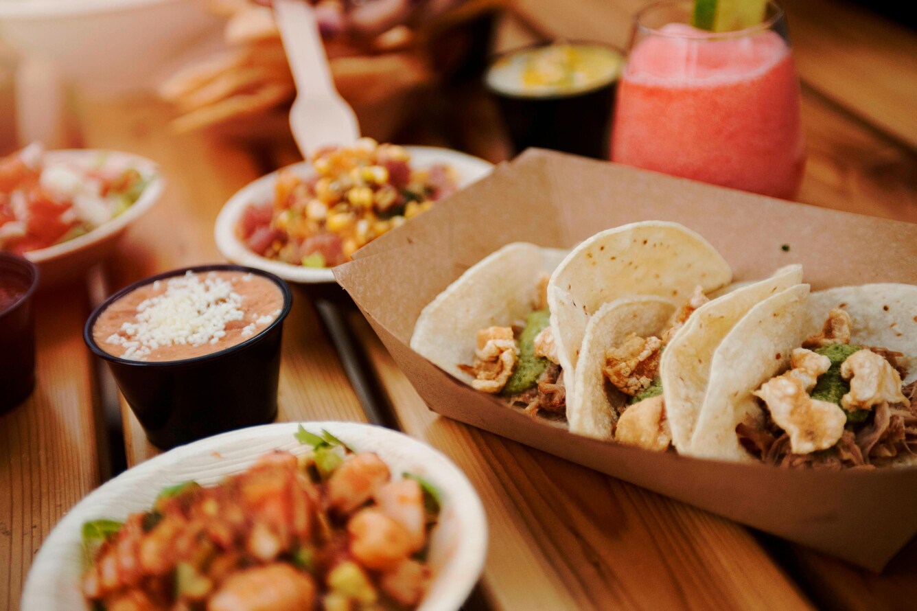 closeup of bar food including street tacos and ceviche