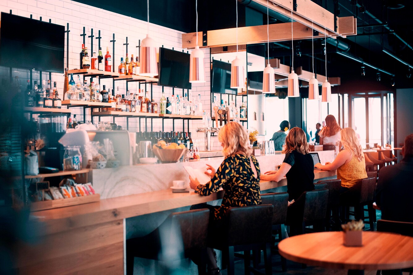 breakfast bar with people sitting and chatting