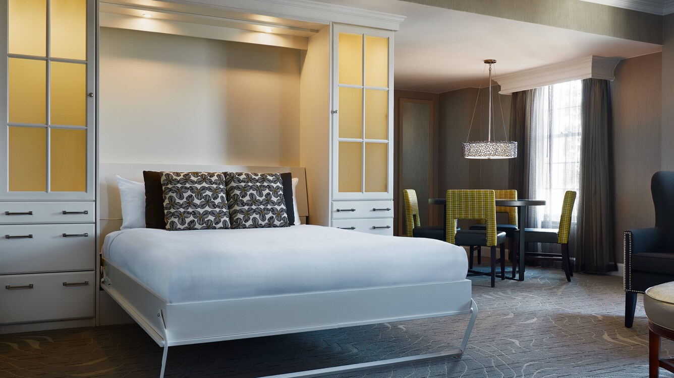 Fold down bed in sitting area of suite.