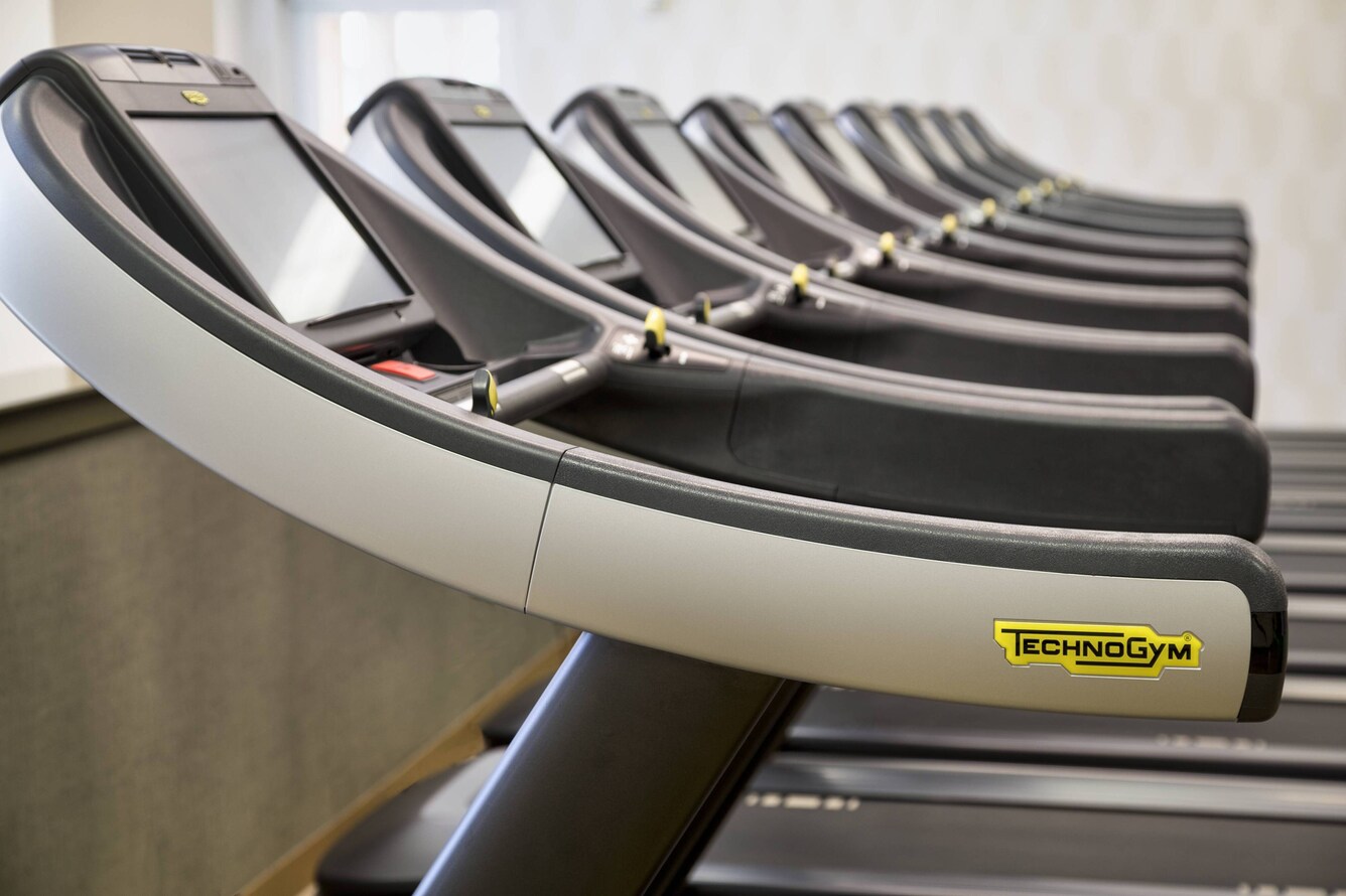 Close up of Technogym treadmill screens from the side