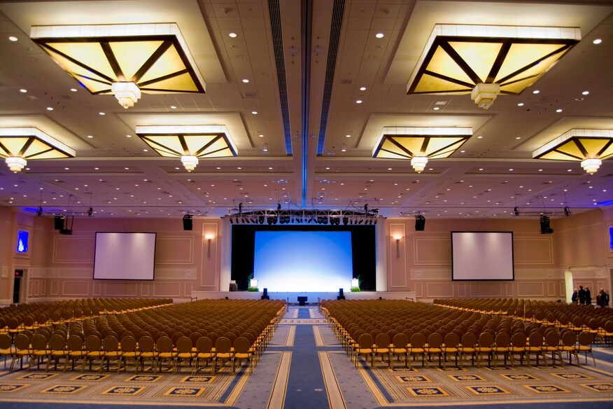 Room with Chair lined up and screens at the front