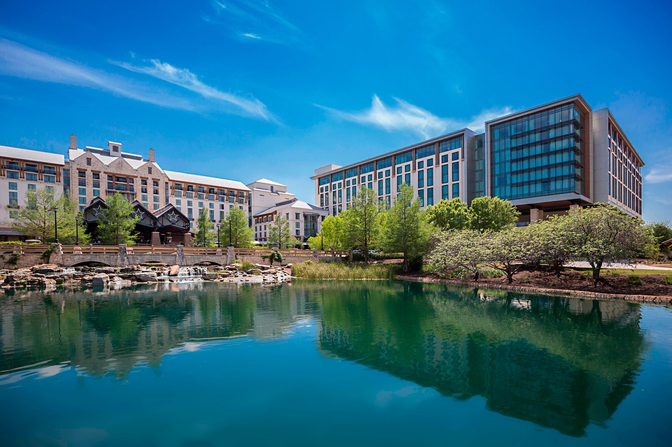 Exterior view from lake looking inward at gaylord texan resort and vineyard tower